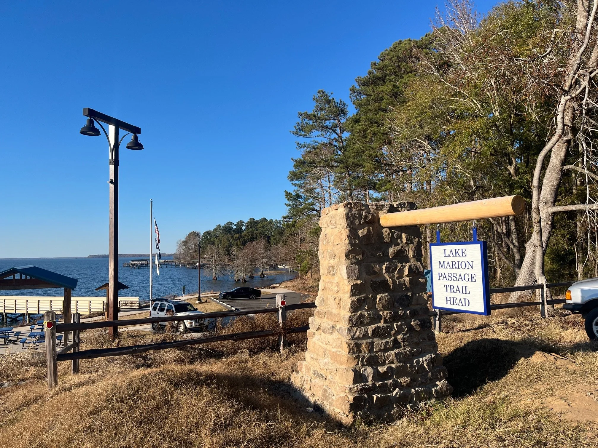 Stone and wooden sign for the Lake Marion Passage of the Palmetto Trail on the northern end