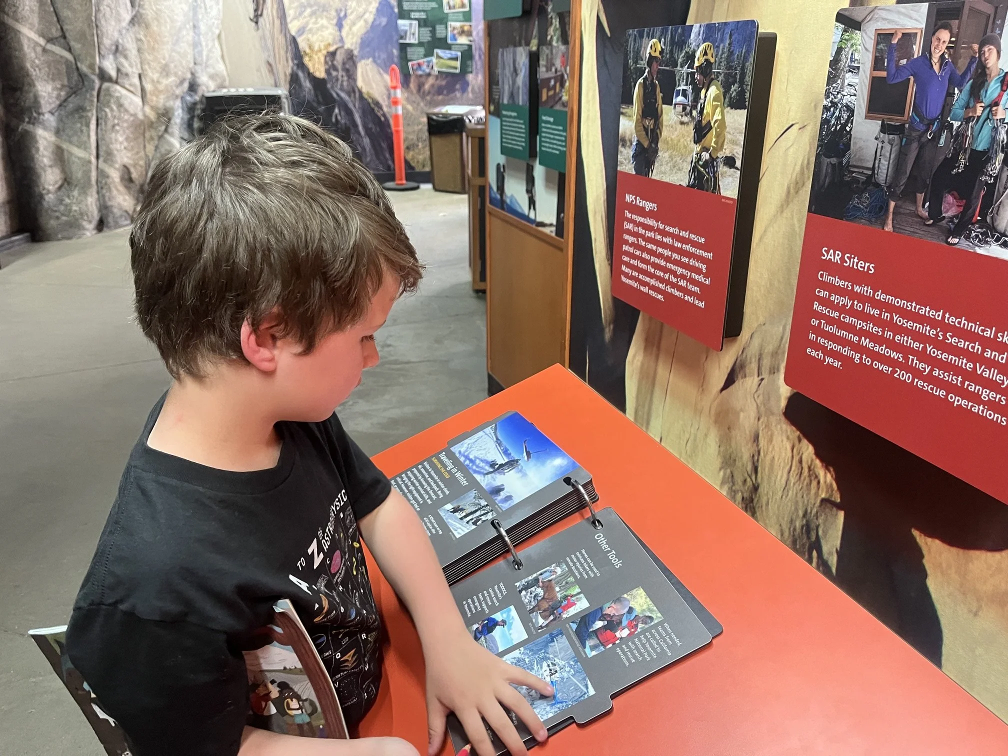 The author's son looking through the interactive materials in the Yosemite Village Exploration Center