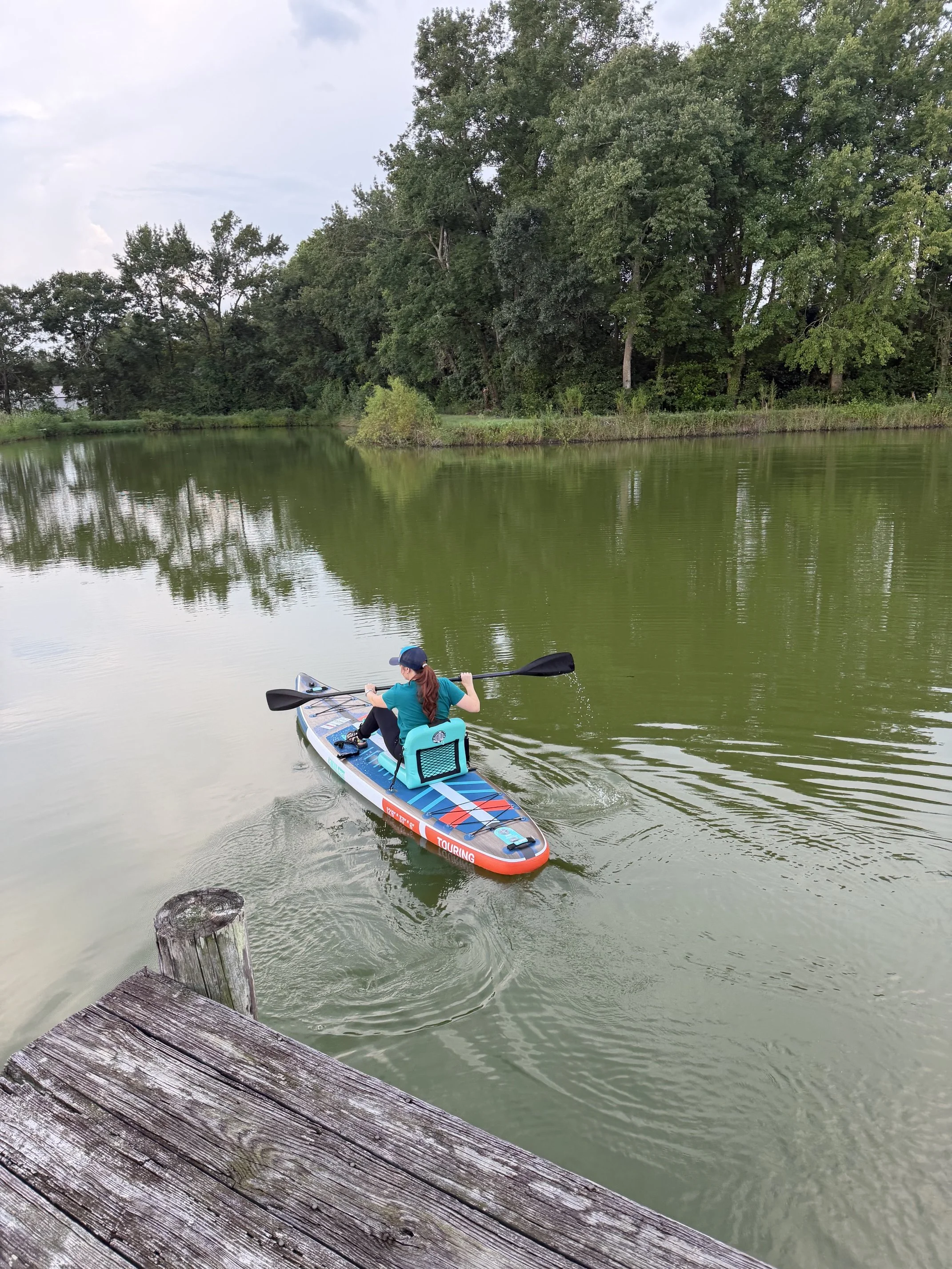 The author on the paddle board with the inflatable seat attached