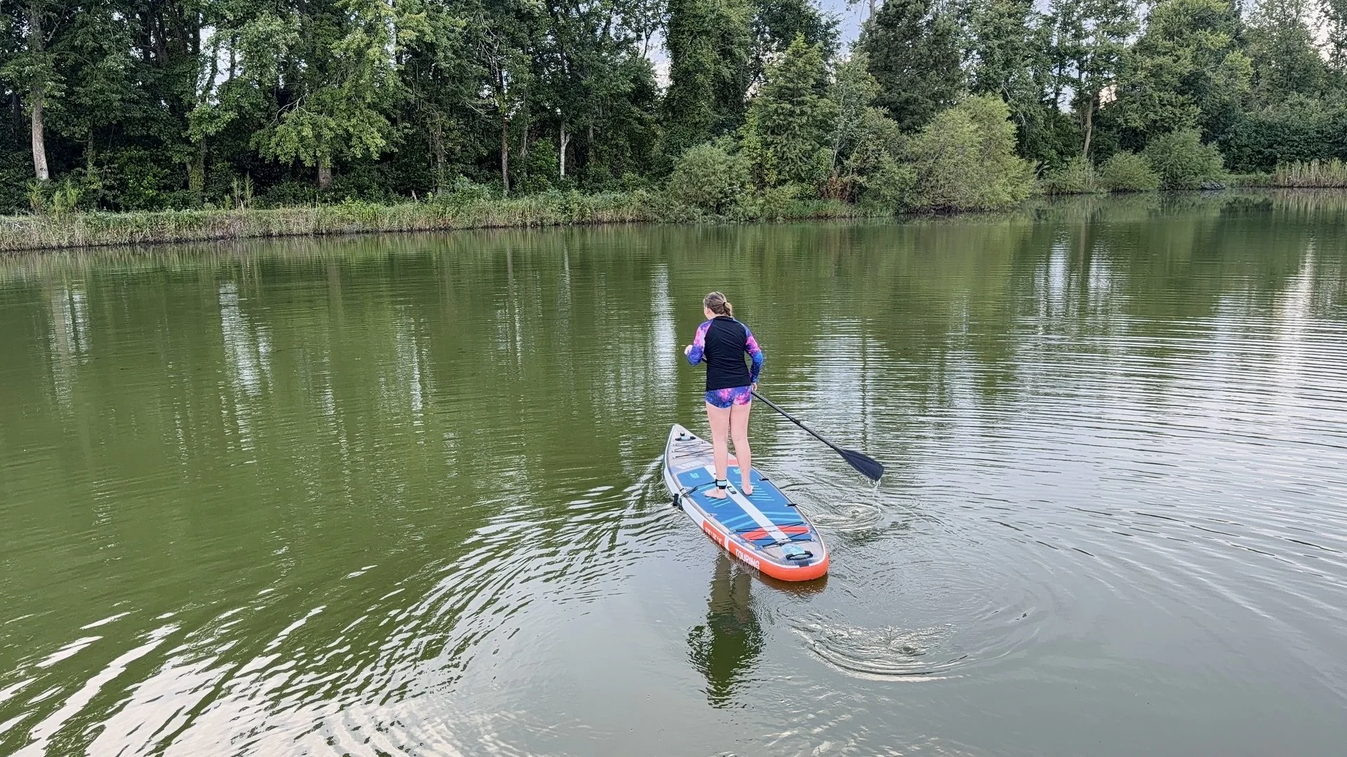My daughter sets out on the paddle board