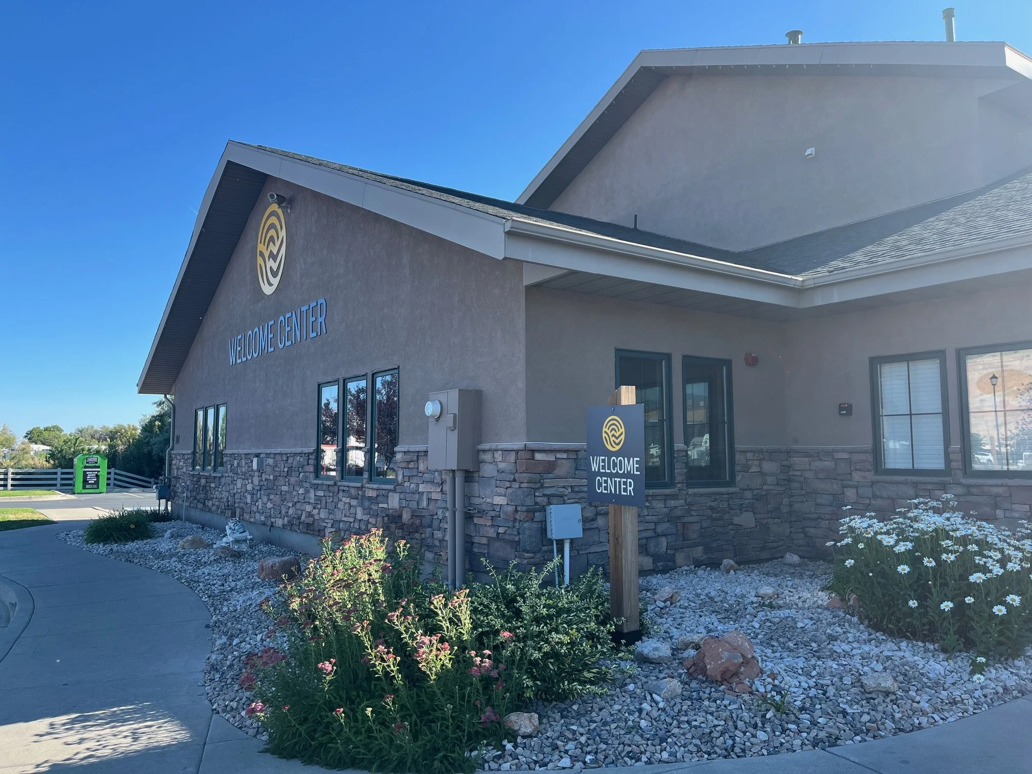 The stucco and stone exterior of the Sun Outdoor Salt Lake City campground welcome center