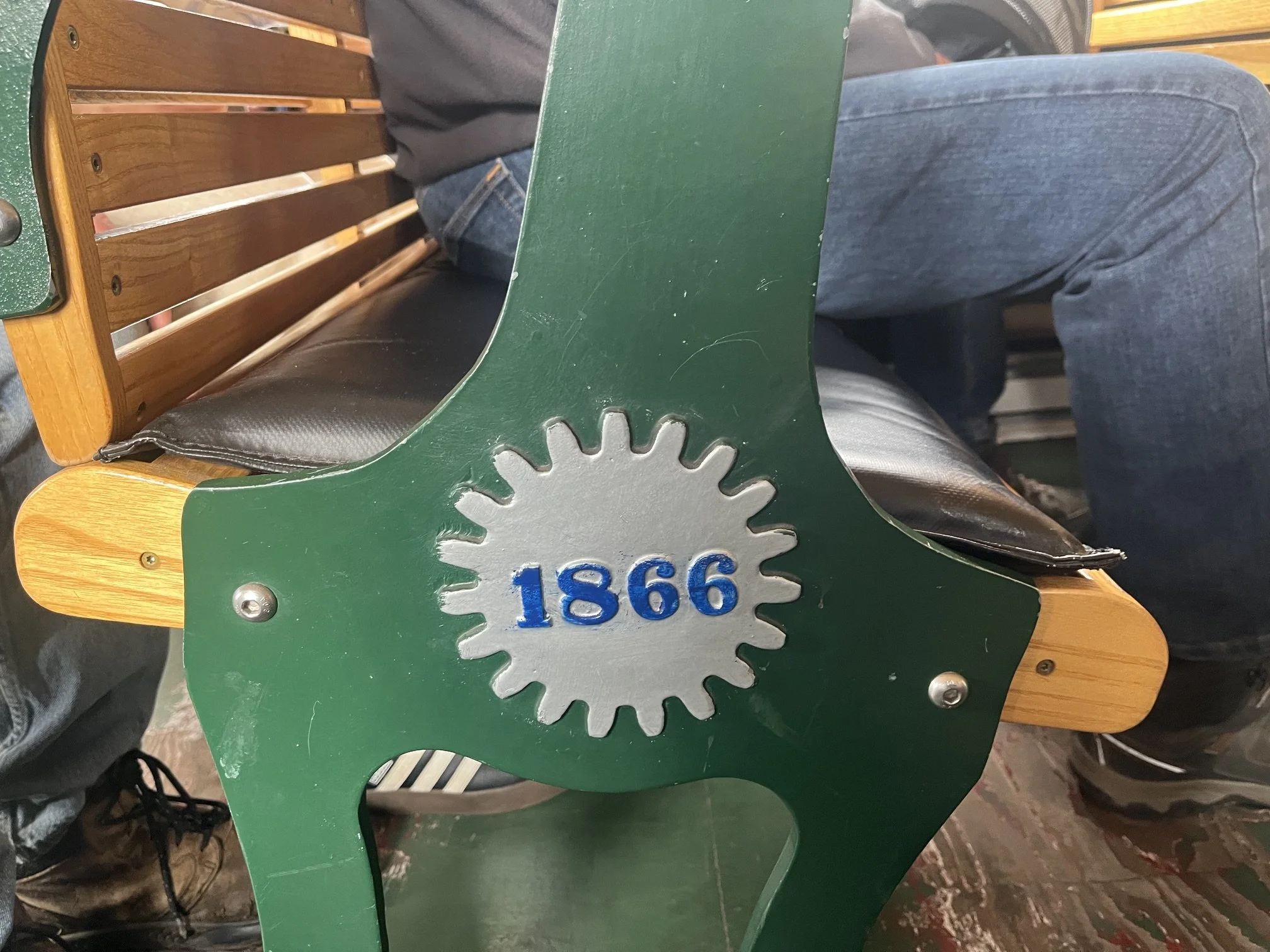 Cog and year 1866 painted on the benches inside the passenger car