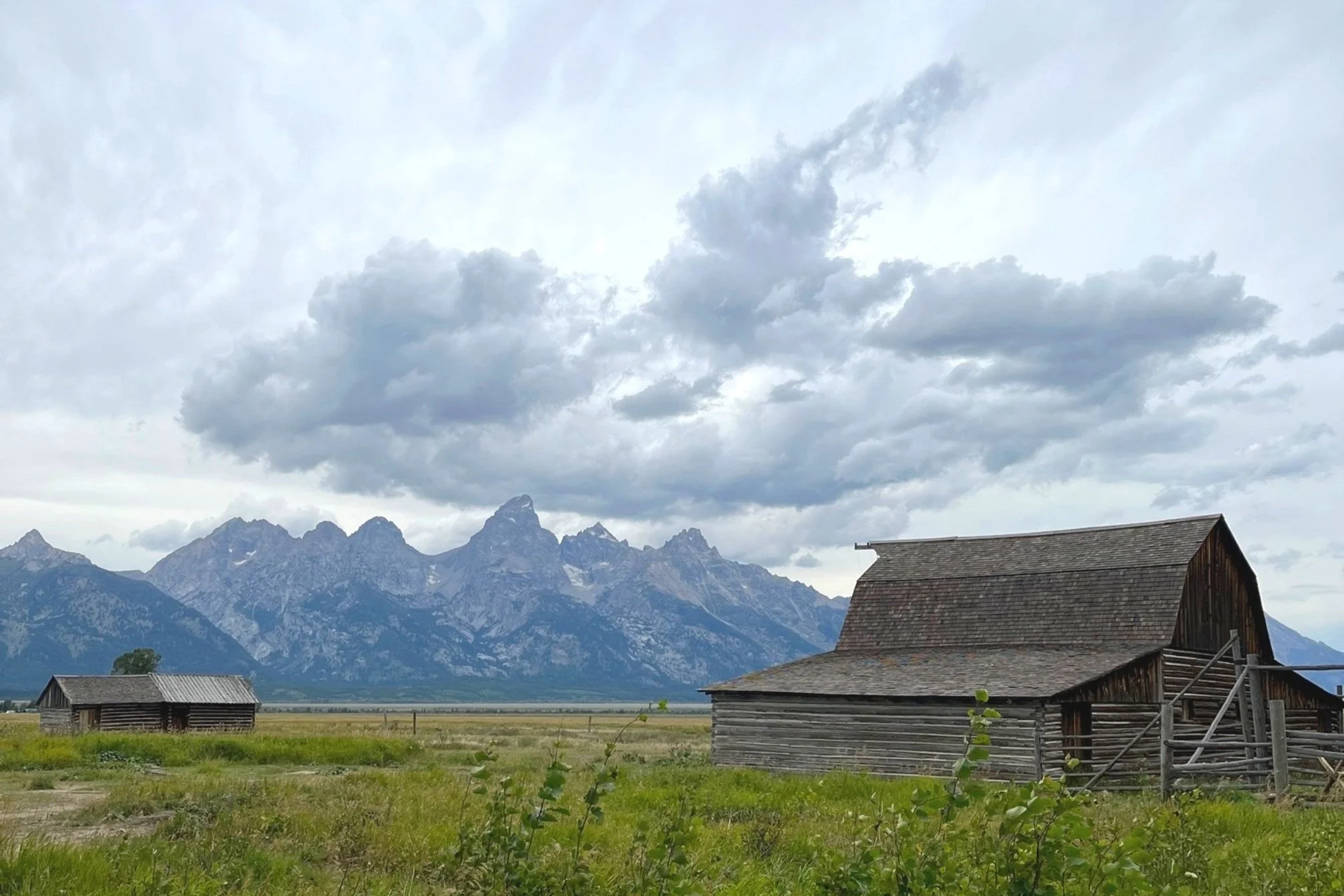 The T.A. Moulton barn on Mormon Row with the Grand Teton mountains in the distance