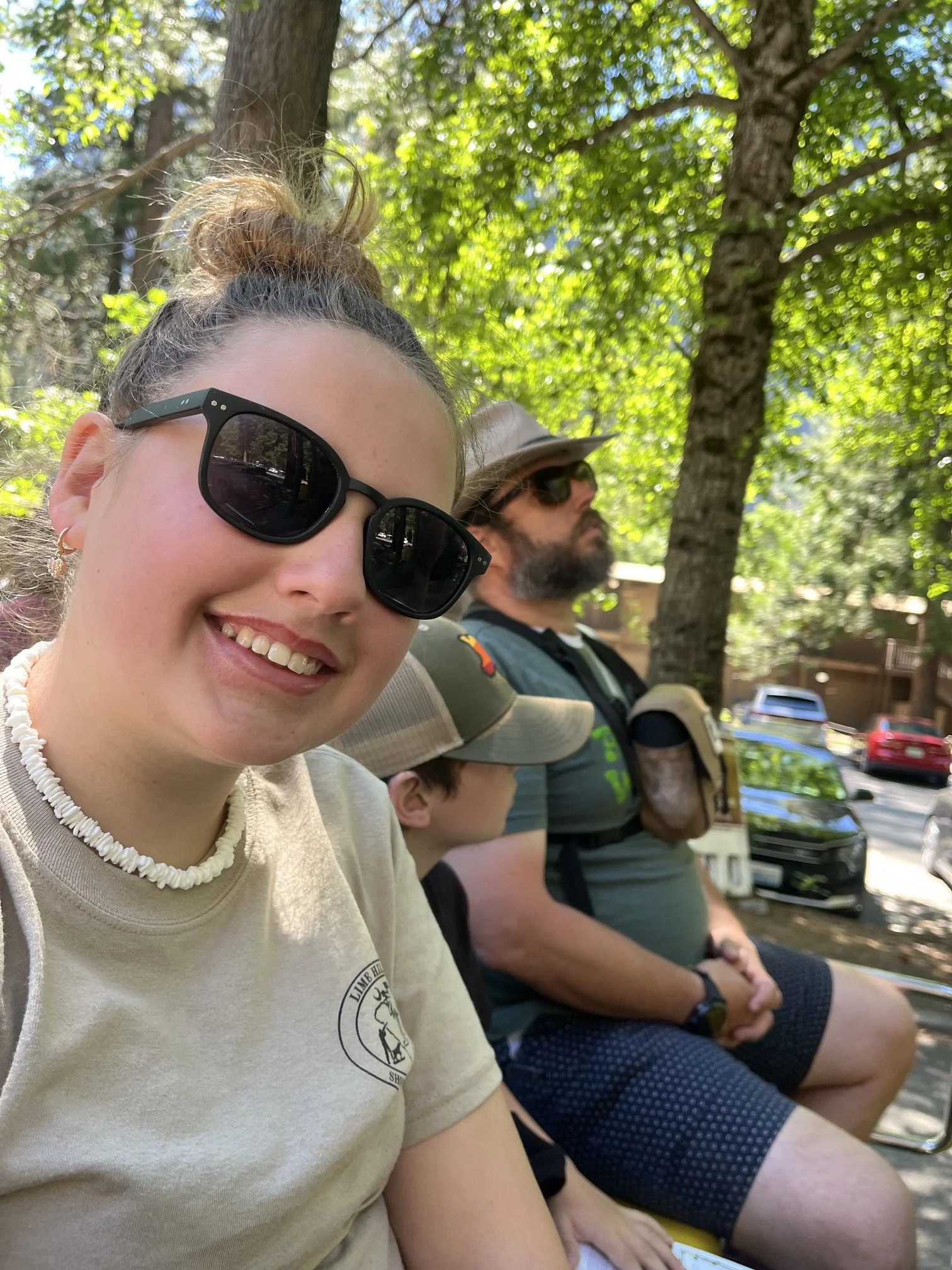 The author's daughter with sunglasses on and smiling while on the tour