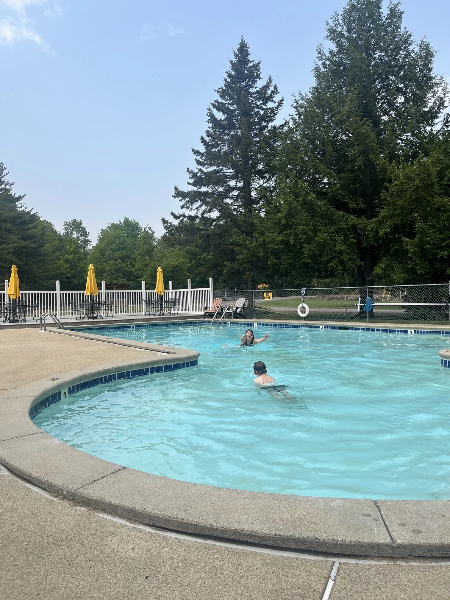 The author's children play in the pool at the Lincoln Woodstock KOA