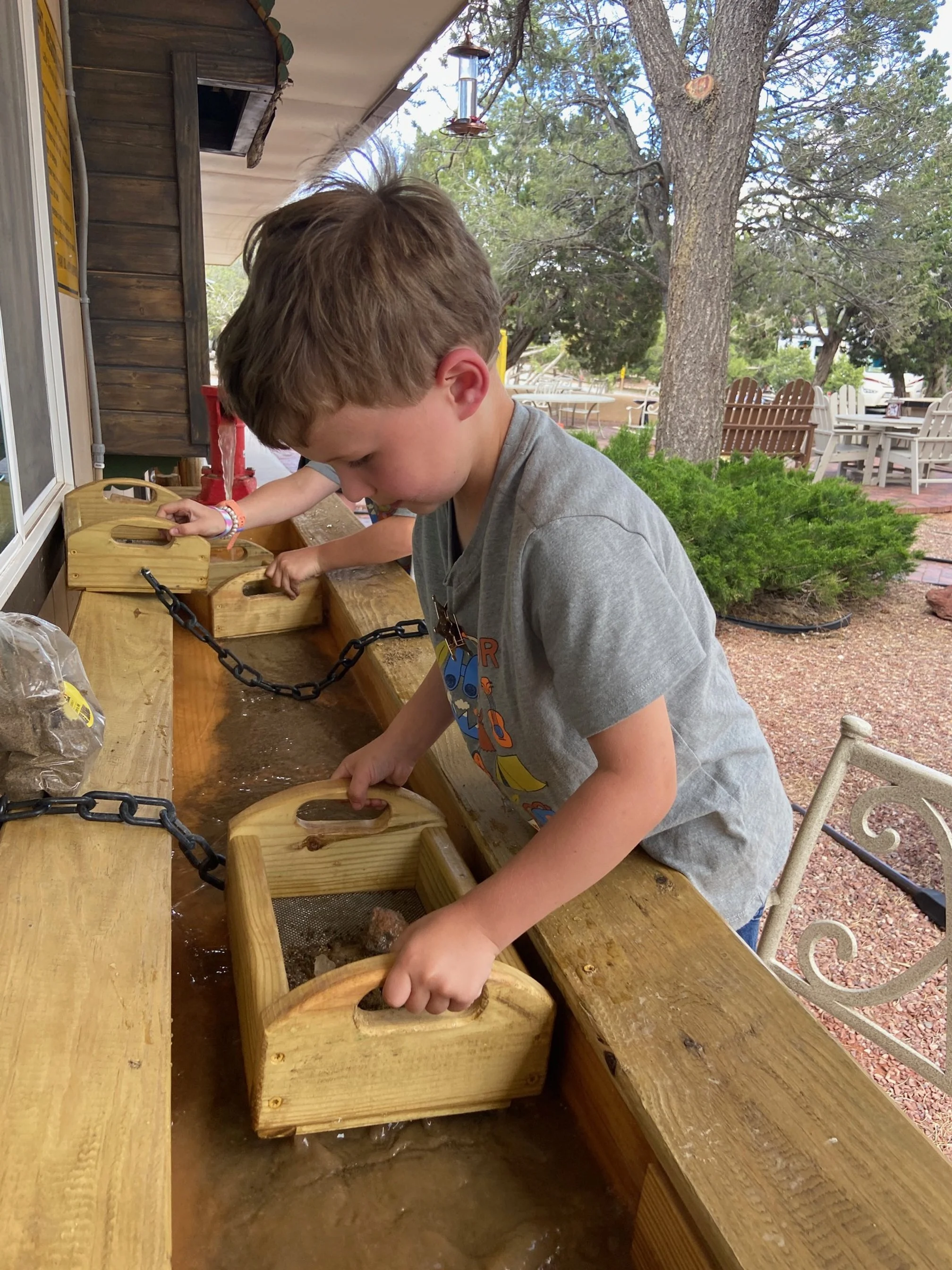 The author's children go gem mining outside the Santa Fe KOA front office