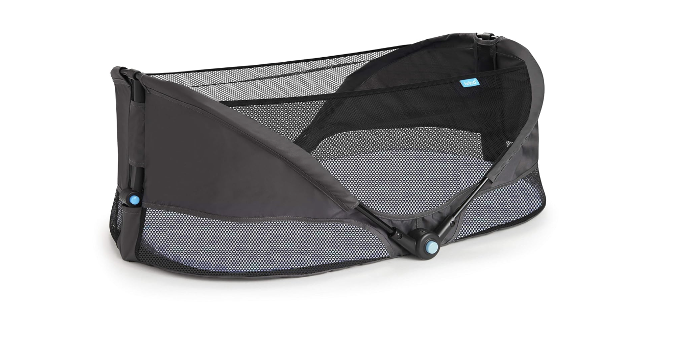 Black floor bassinet with mesh paneling on top and sides