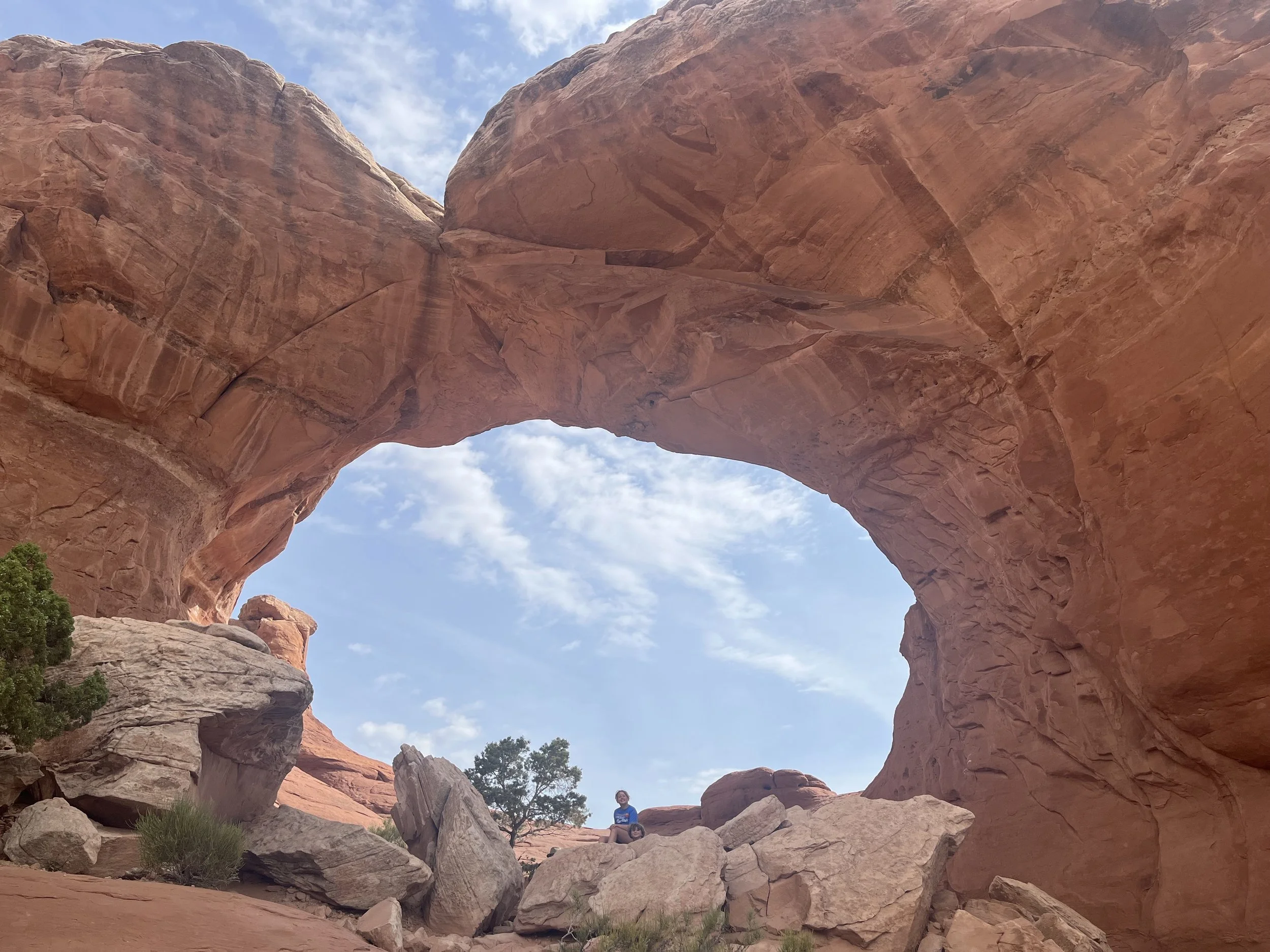 The author's children standing underneath Broken Arch