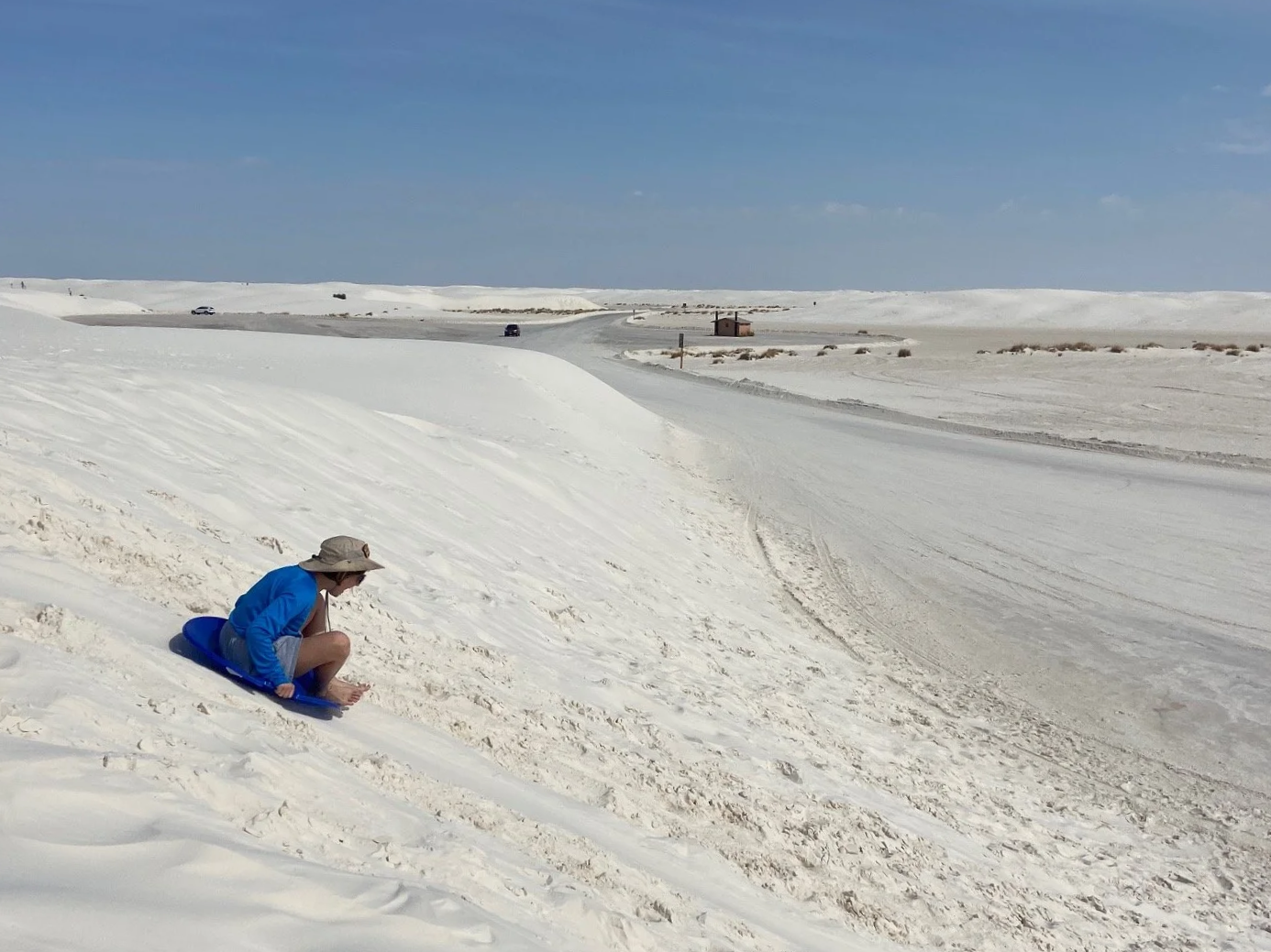 The author's daughter sleds down a dune near one of the picnic areas