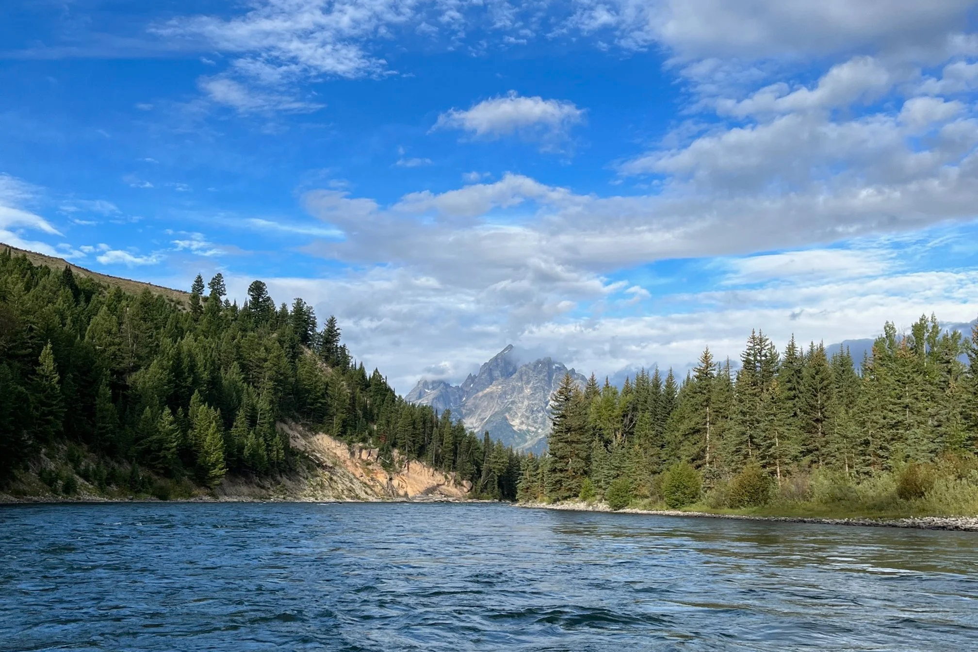 The Teton mountains as seen from the middle of the Snake River