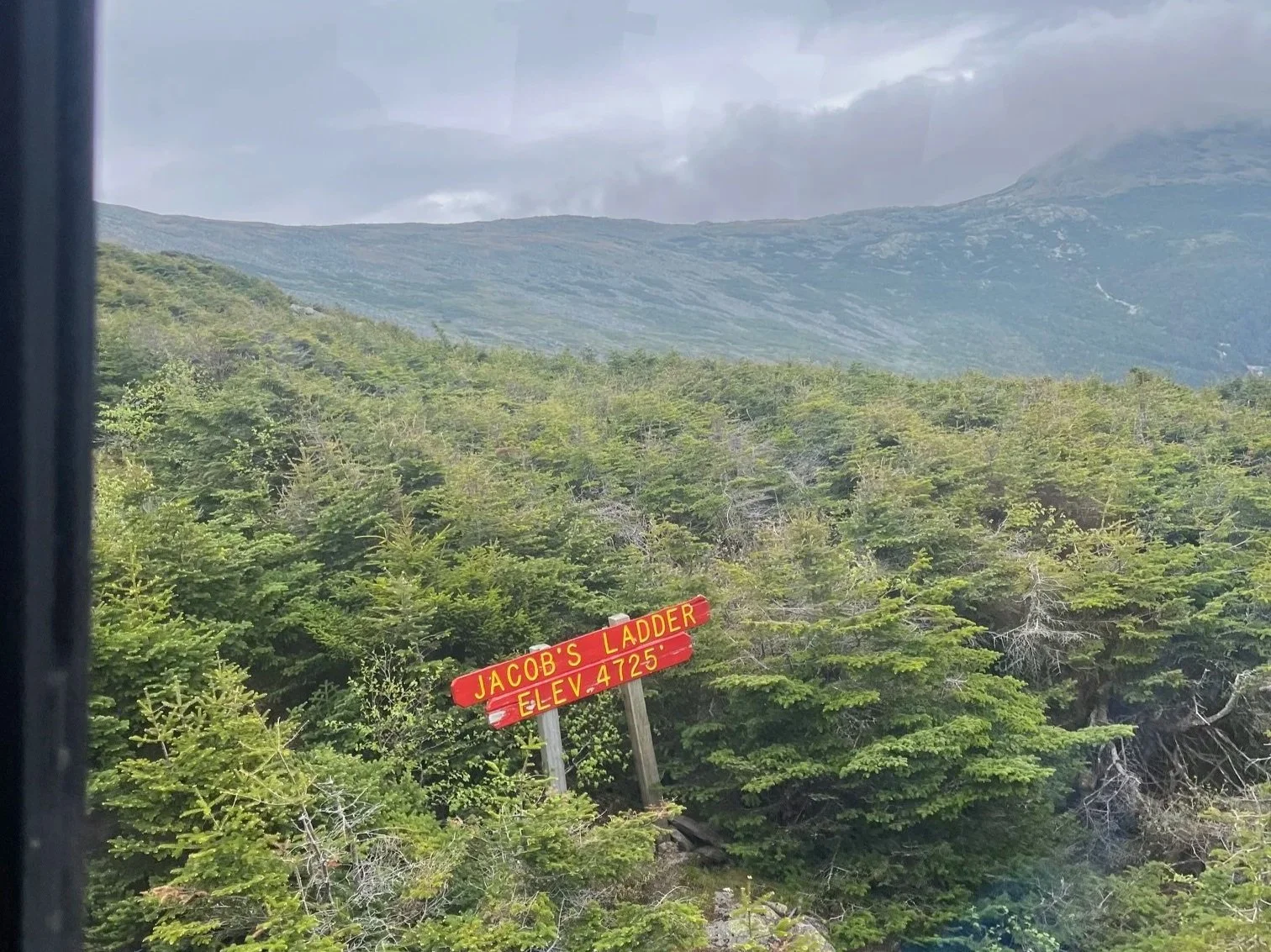 A red wooden sign reads Jacob's Ladder