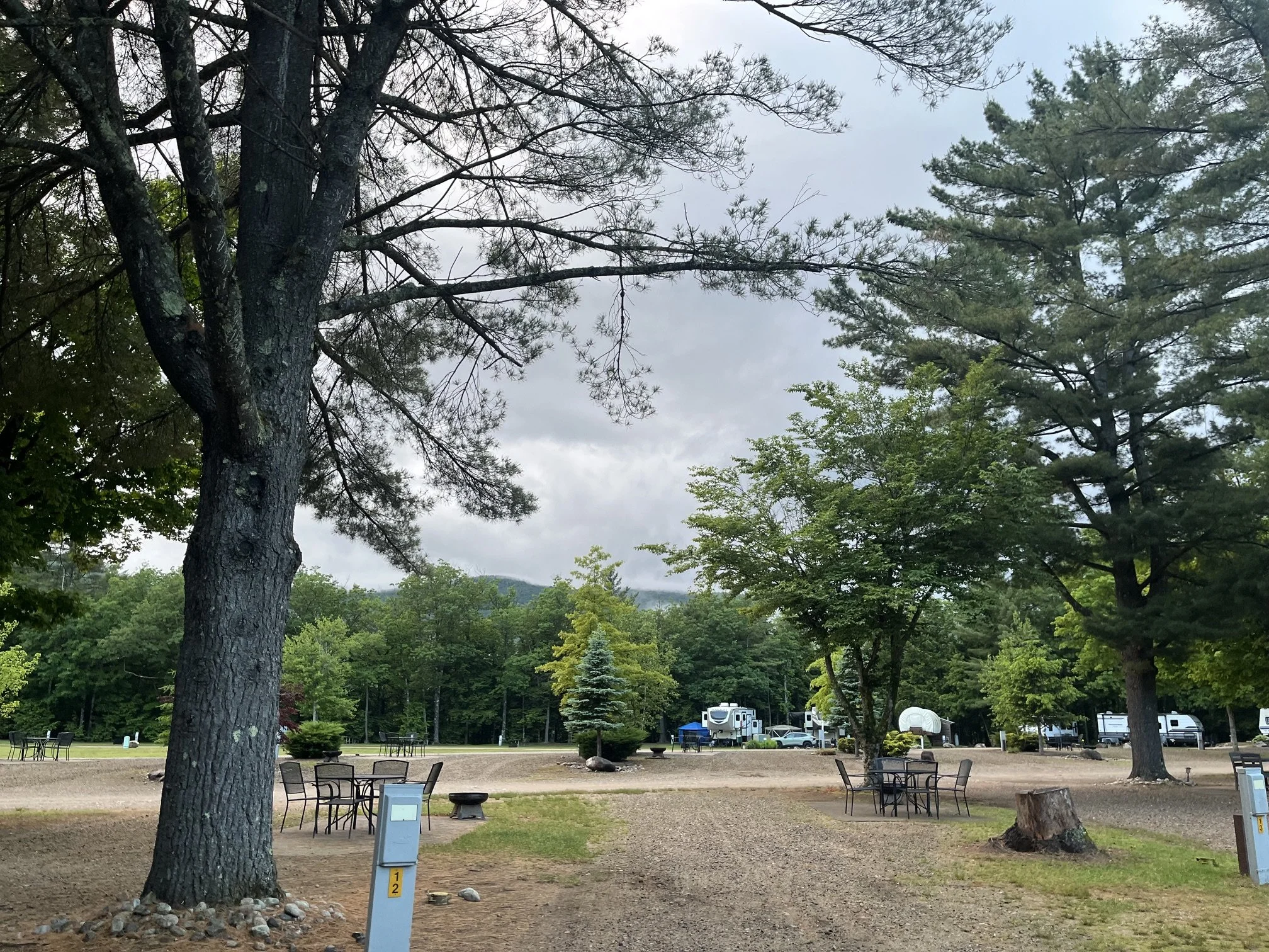 Multiple sites at the Lincoln Woodstock KOA with Conestoga wagon in the background