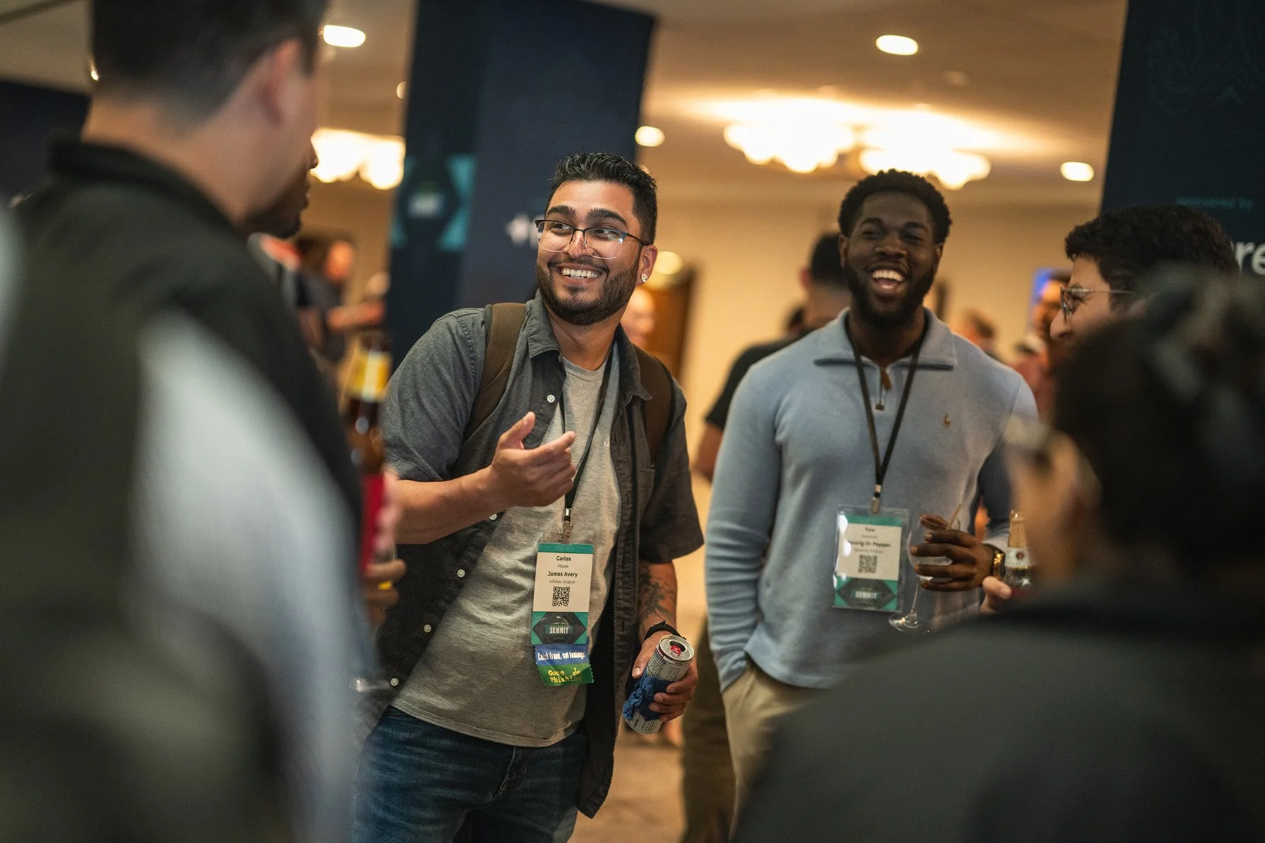 Candid Austin event photography capturing diverse attendees networking and smiling during an evening conference reception.
