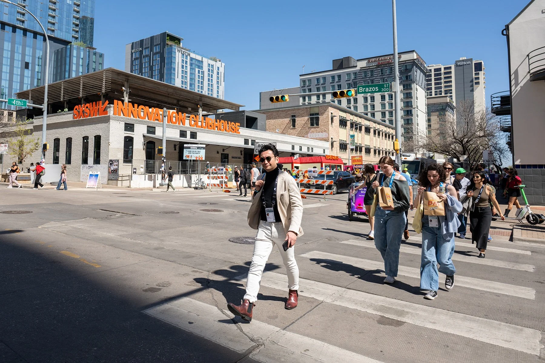 Crowd crossing the street in front of SXSW Innovation clubhouse