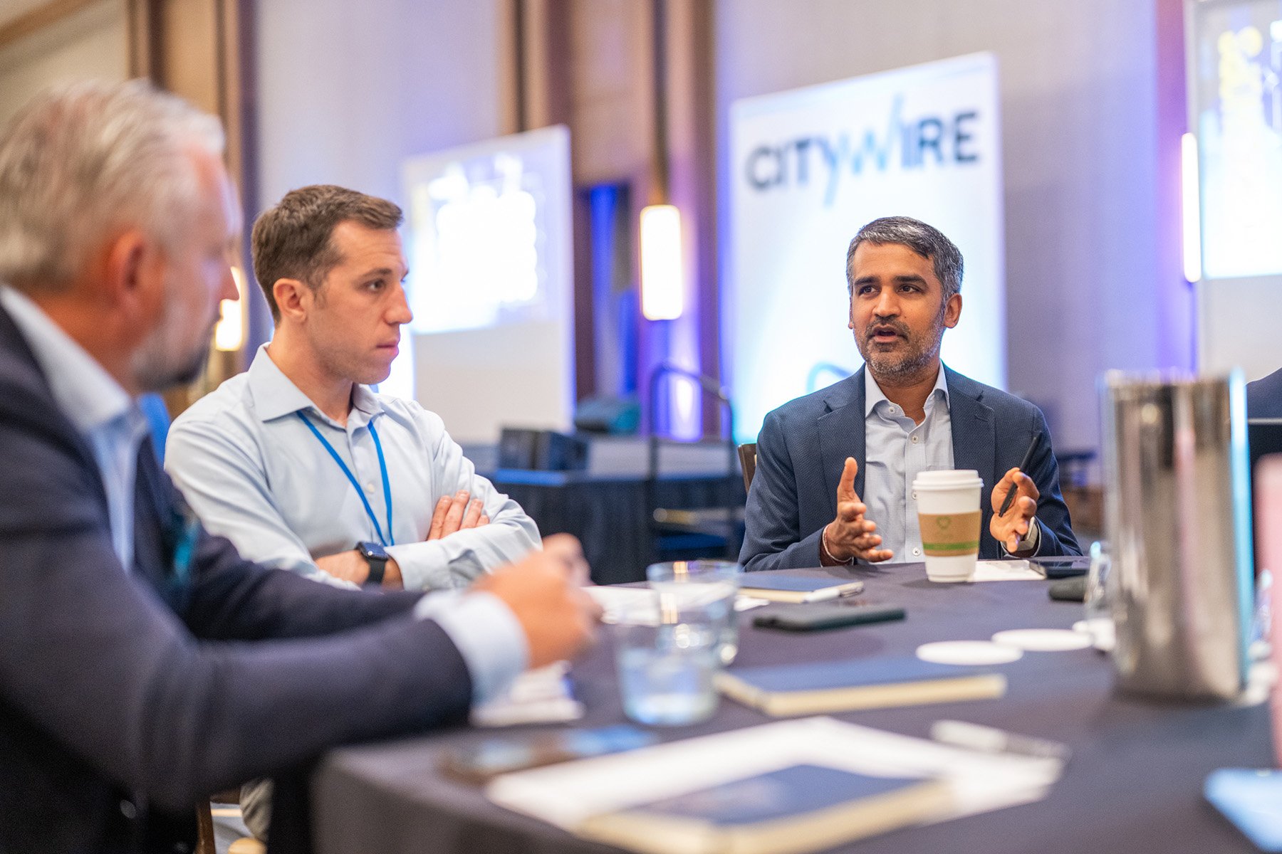 Attendees networking during the Citywire conference.