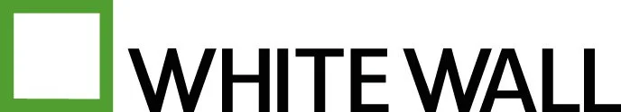 Logo with a green square outline and the text 'WHITE WALL' in black.