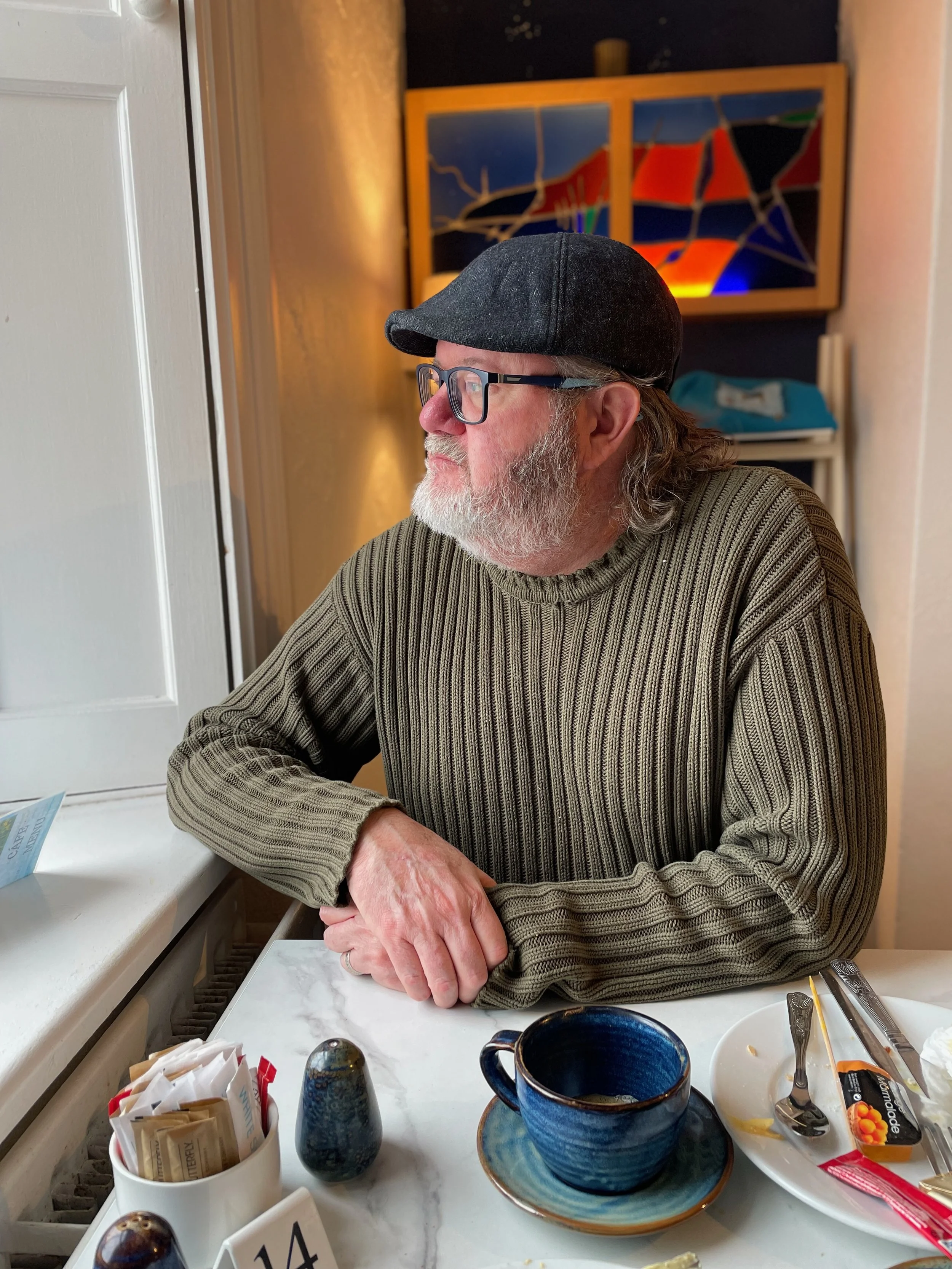Dave Haworth, photographer in the wide having coffee and attempting to look cool.