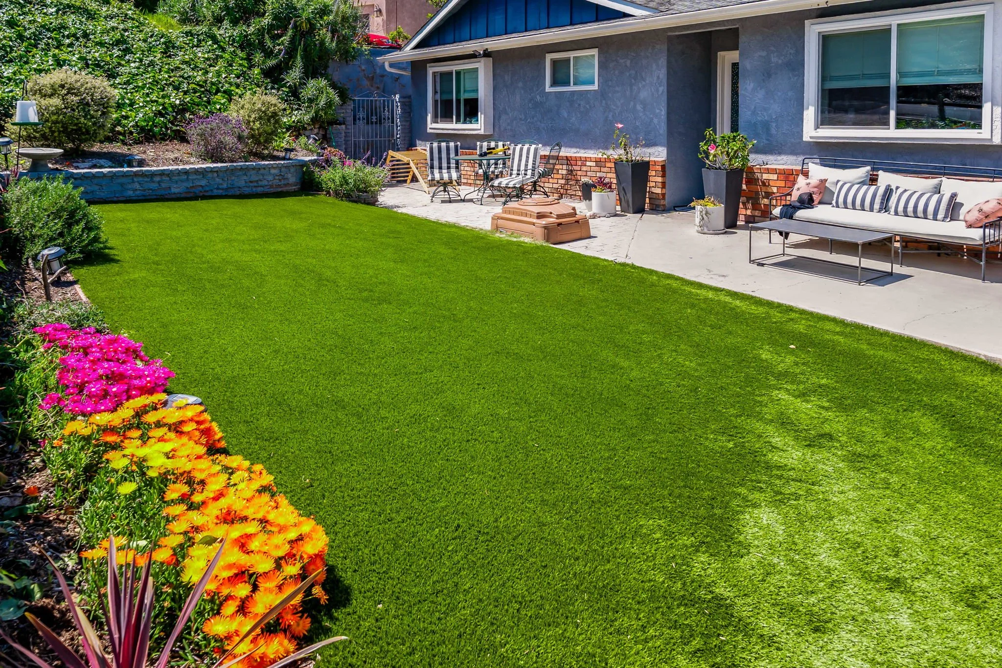 Artificial turf backyard in El Cajon with play space