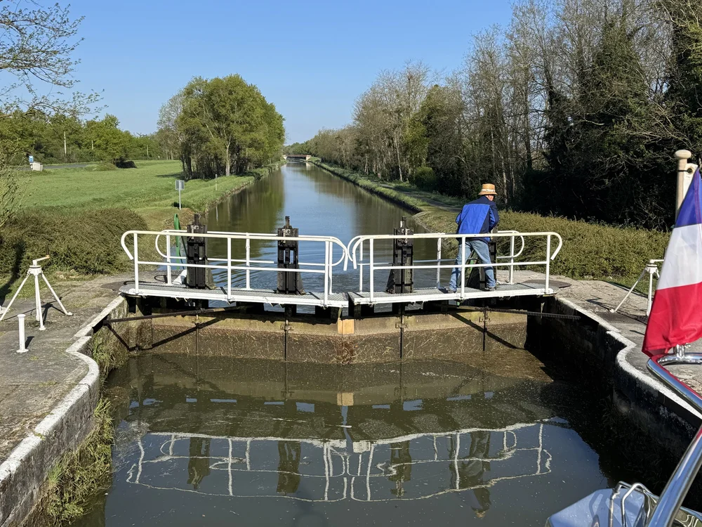   A lock keeper cranks open the sluices in front of us to lower the water level.  