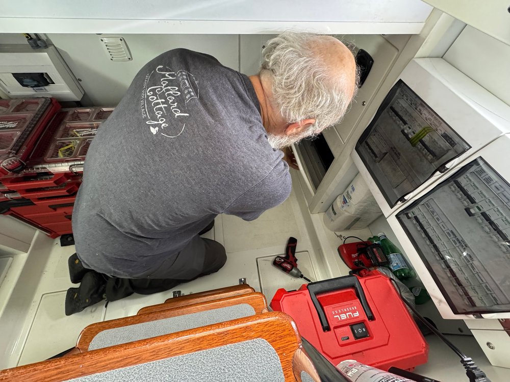   Tom checks for electrical problems.  