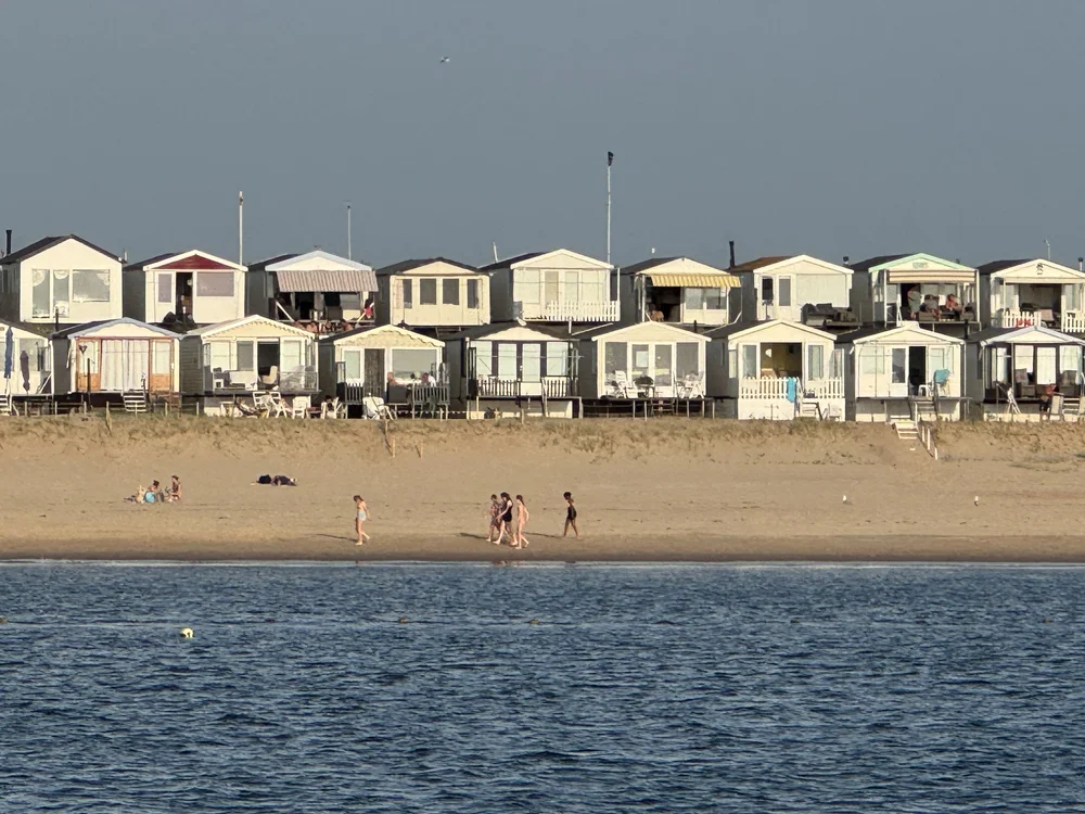   Seaside rental cottages packed in along the beach.  
