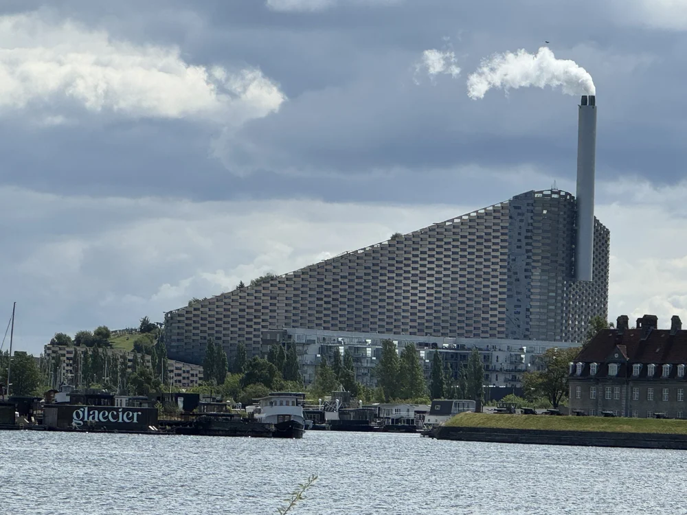   CopenHill is an urban mountain built on top of a waste-to-energy plant. It provides electricity and heating for thousands of homes while featuring a ski slope, hiking trails, and a climbing wall.   