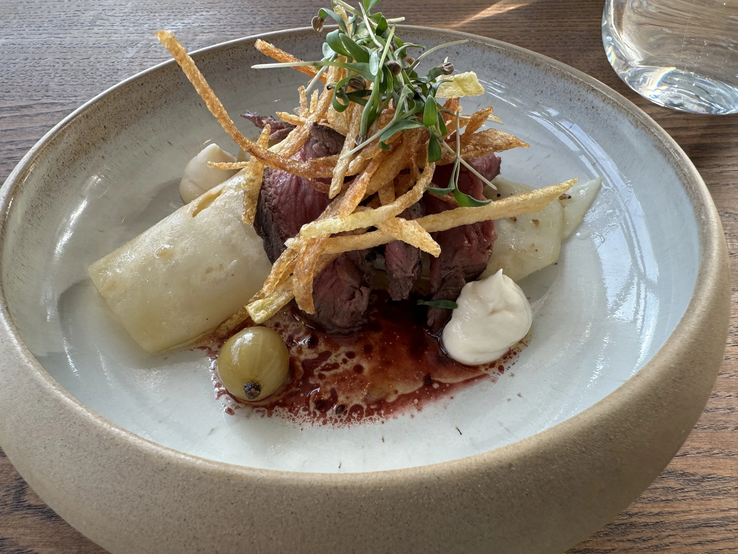   Roasted venison with hazelnut potatoes wild mushrooms and lingonberry sauce.  