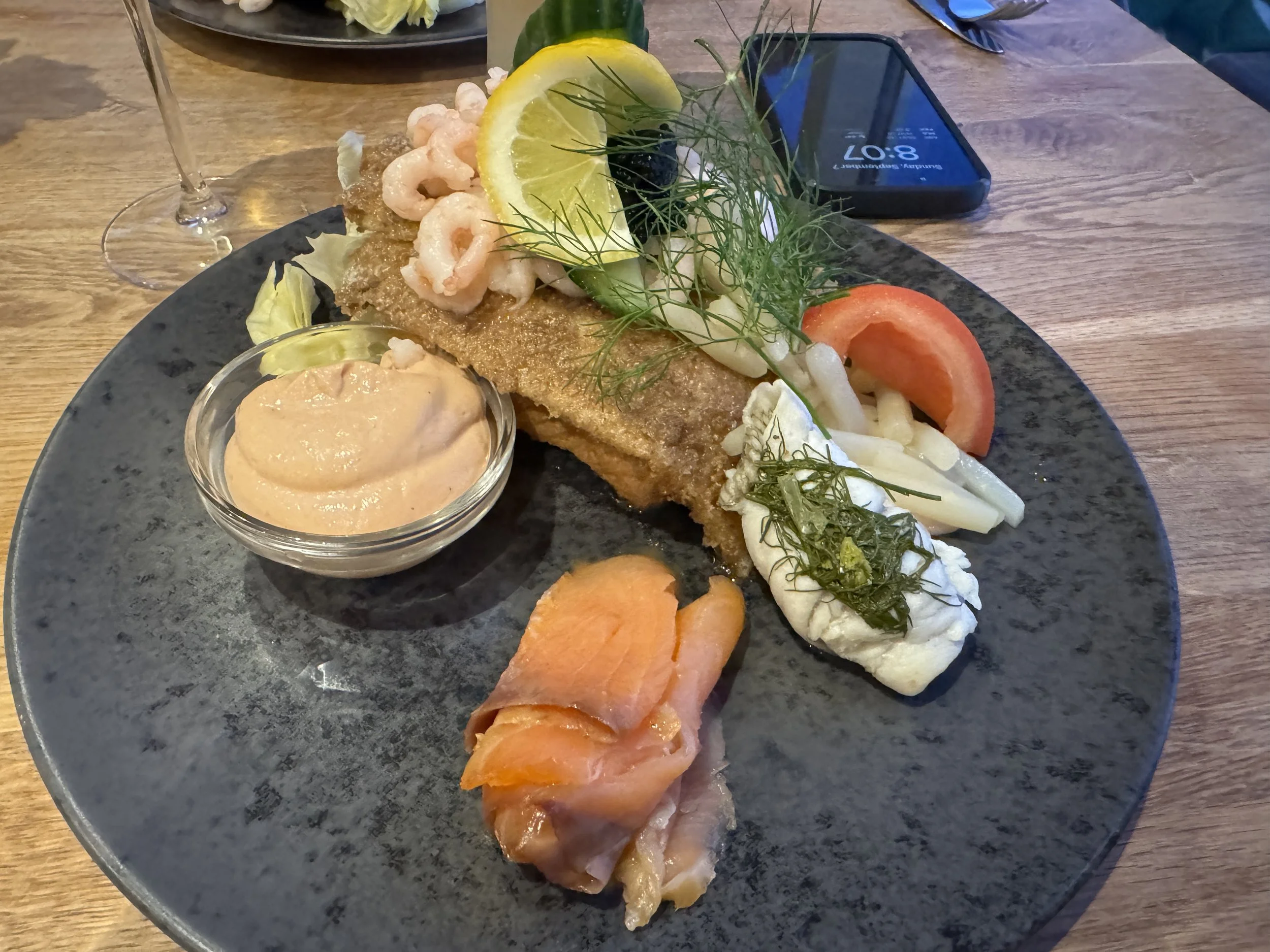   "Sterneskud" which means shooting star is a popular dish made of fried fish fillets combined with salmon and shrimp on toasted bread topped with asparagus, caviar, a lemon wedge and served with something akin to thousand island dressing.  