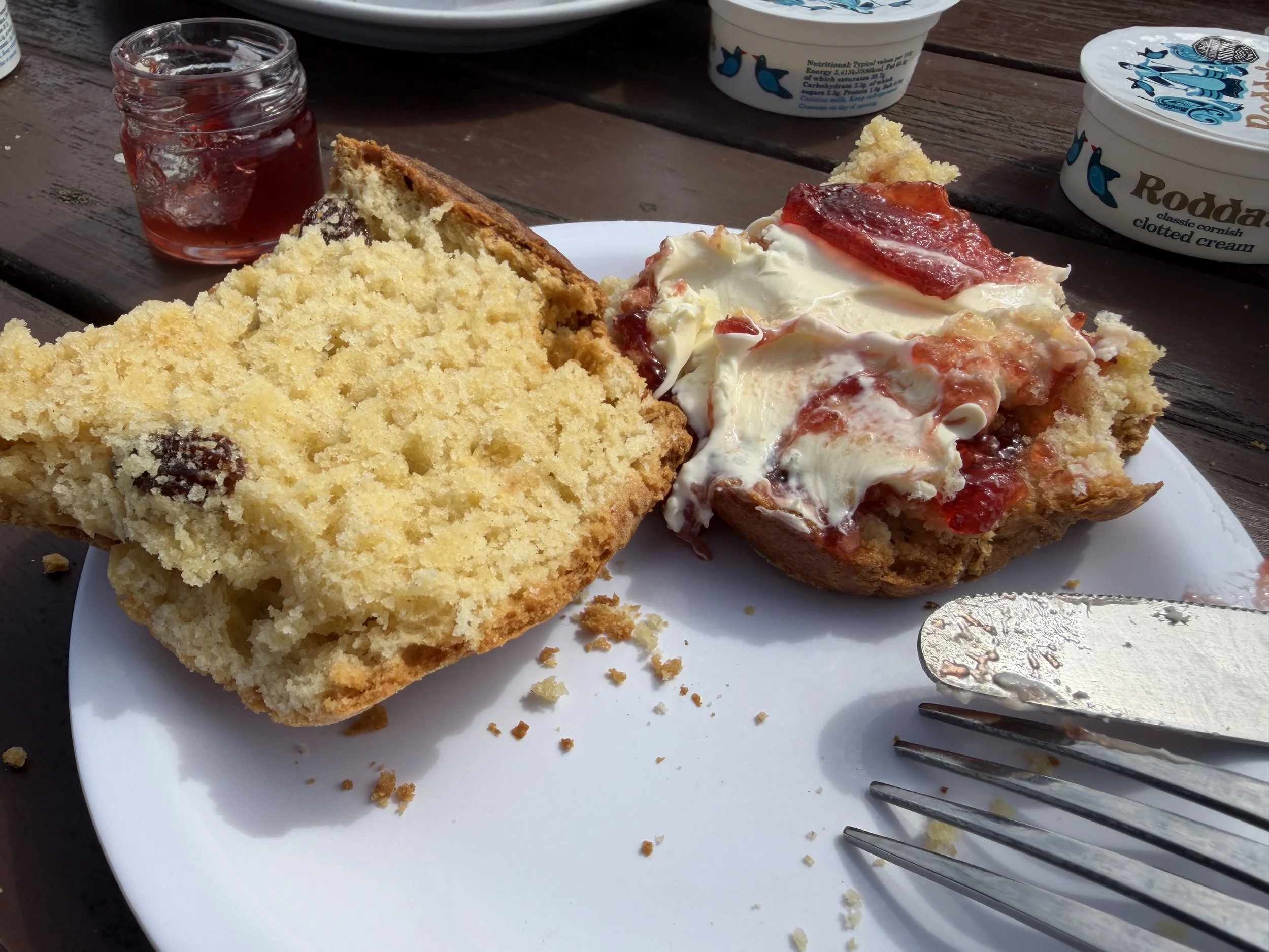   Cream tea is a traditional British afternoon snack consisting of warm scones, clotted cream, strawberry jam and a spot of tea.   