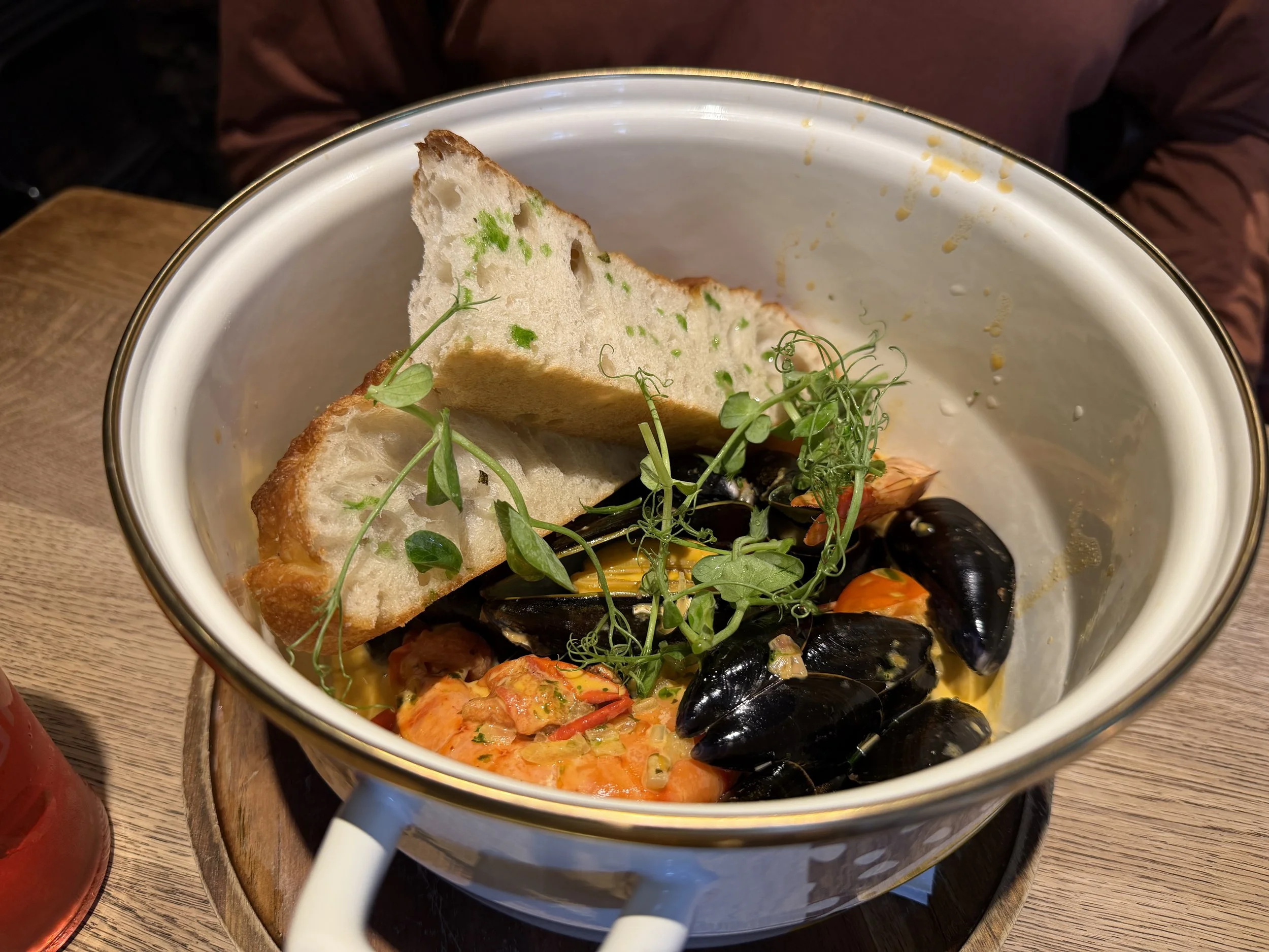   A huge pot of shellfish: clams, mussels and prawns.  