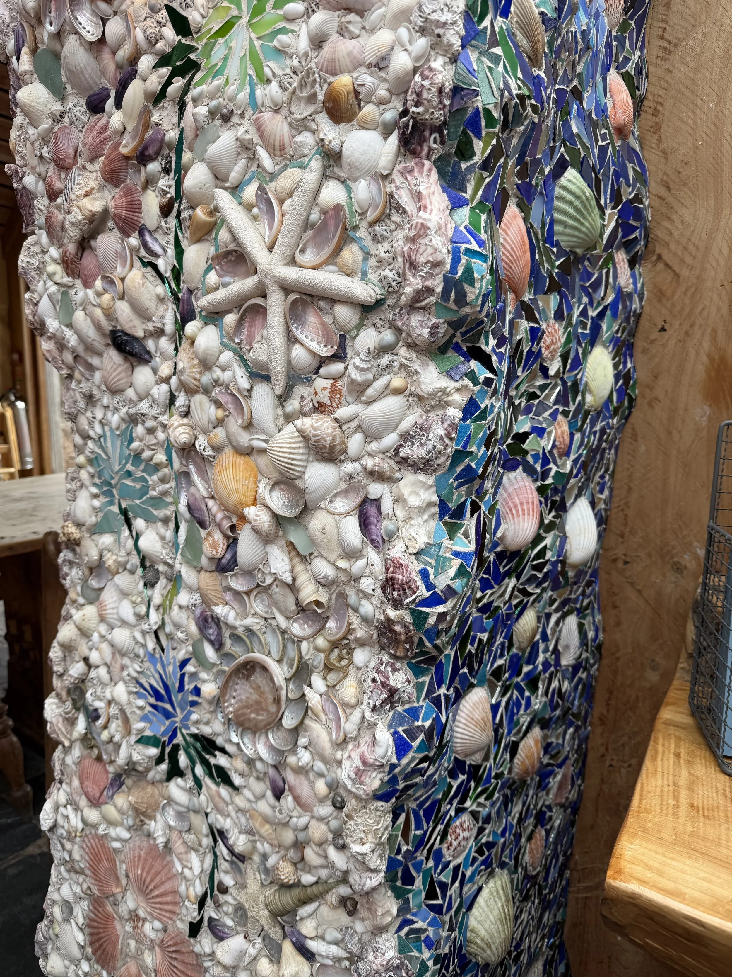   Intricate shell mosaics on the posts inside  