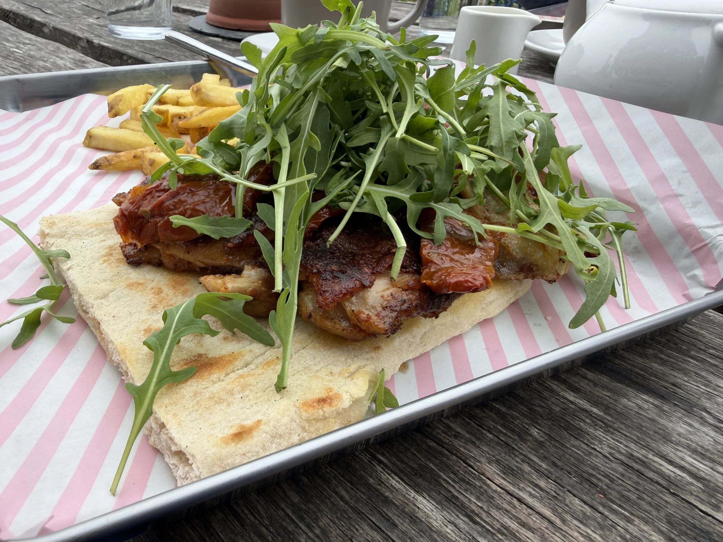   Grilled chicken and sun-dried tomatoes on flat bread.  