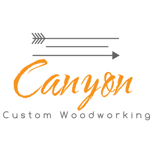 Logo for Canyon Custom Woodworking with an arrow graphic above the text.