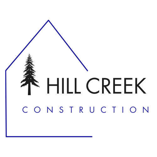 Logo for Hill Creek Construction featuring a pine tree, a house outline, and the company name.