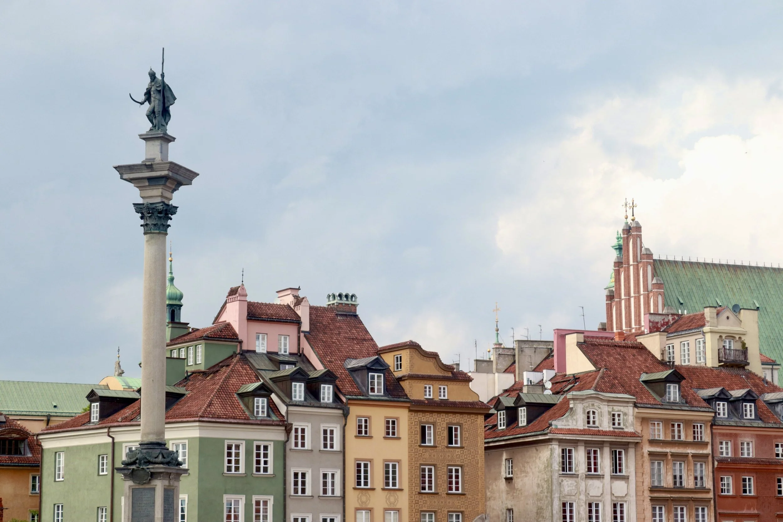 Clothing rack with various assorted clothing items.