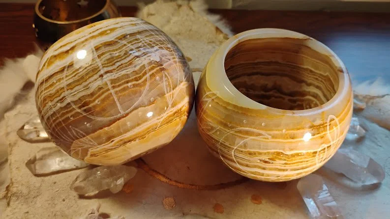 set of calcite candle holders with solar imagery