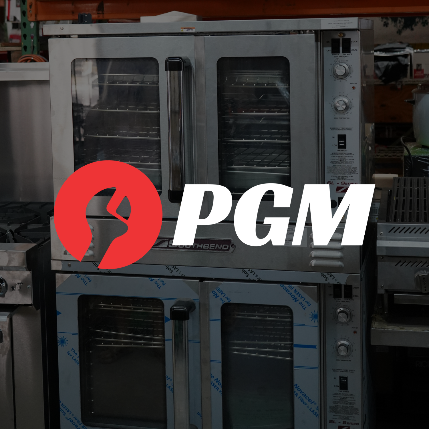 Two commercial convection oven units in a warehouse setting.