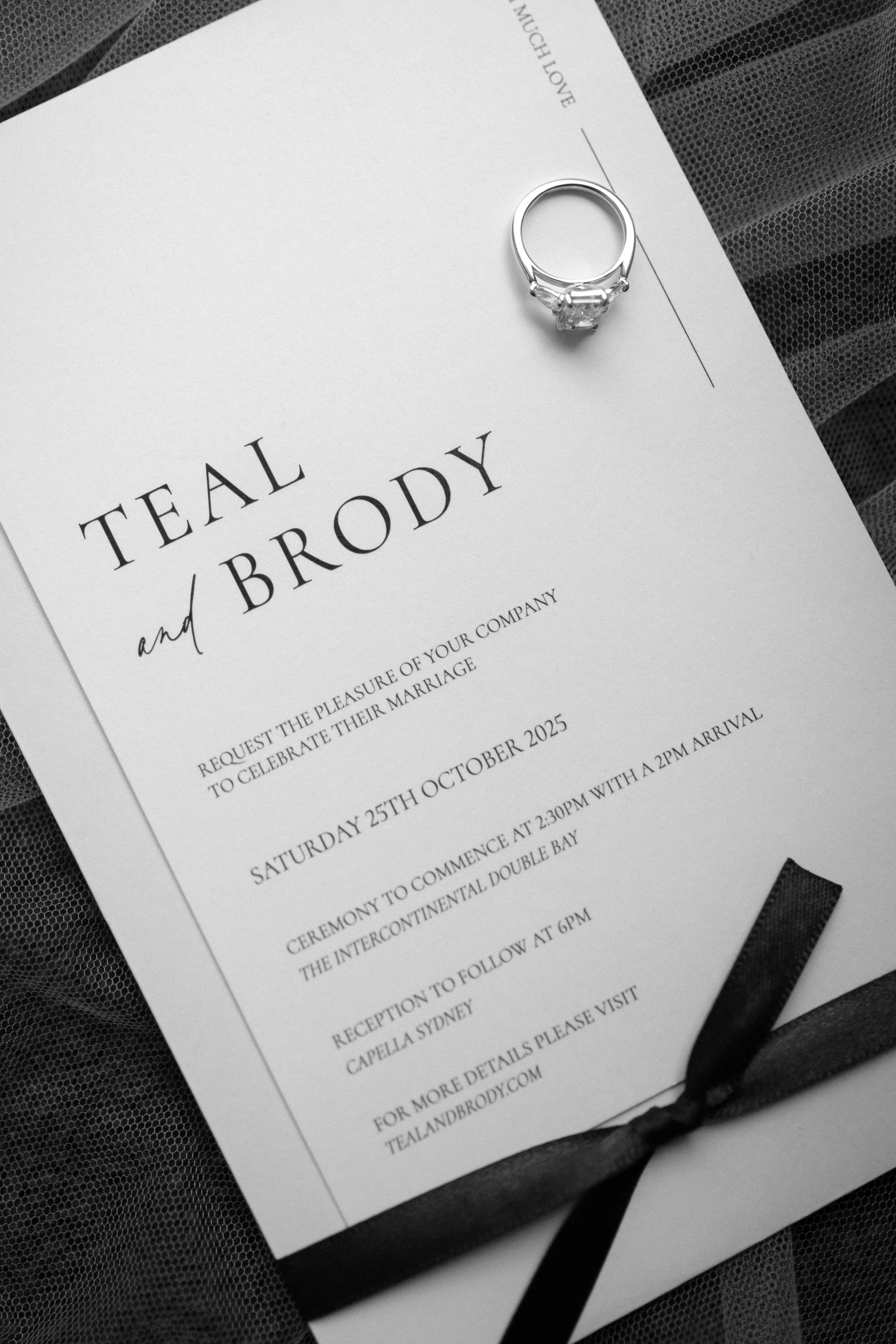 Wedding invitation for Teal and Brody with a diamond ring placed at the top right corner.