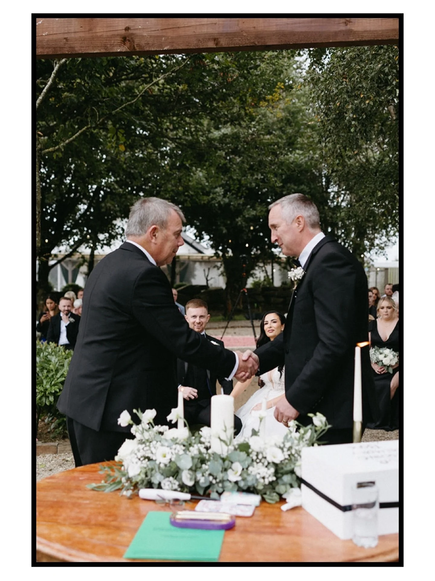 A picture really can say a lot. 🤍 

Tiffany&rsquo;s dad and Adam&rsquo;s dad shaking hands after lighting the unity candles, with the couple looking on. I love this photo for its layers, not just in the composition, but in what it represents too. Tw