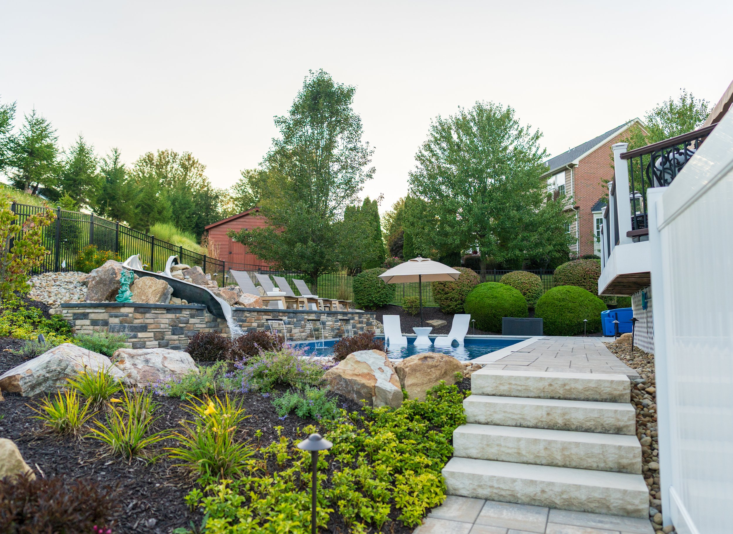Landscape backyard with lighting and stone steps 