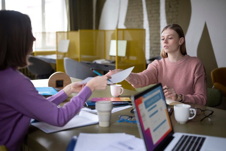 women-working-together-office_23-2149345224.jpg