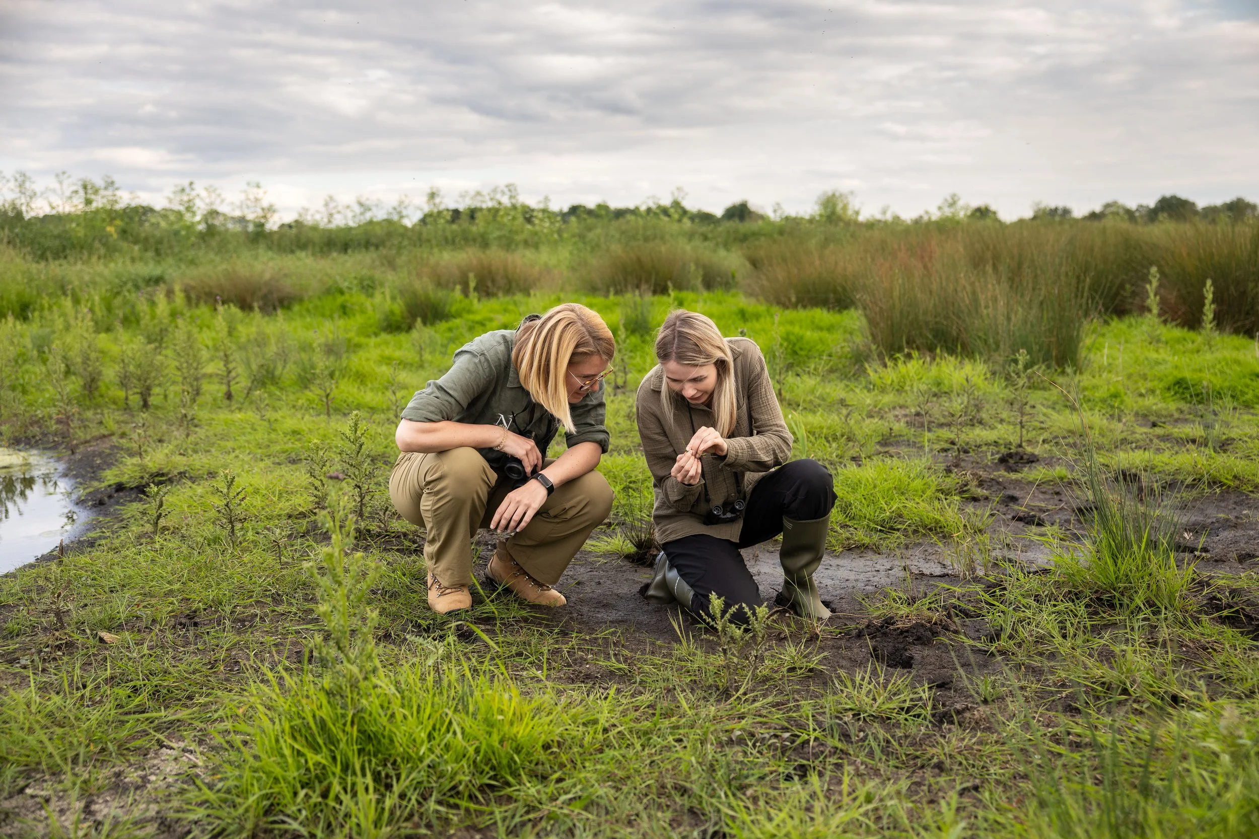 Two people talking in High Fen Wildland
