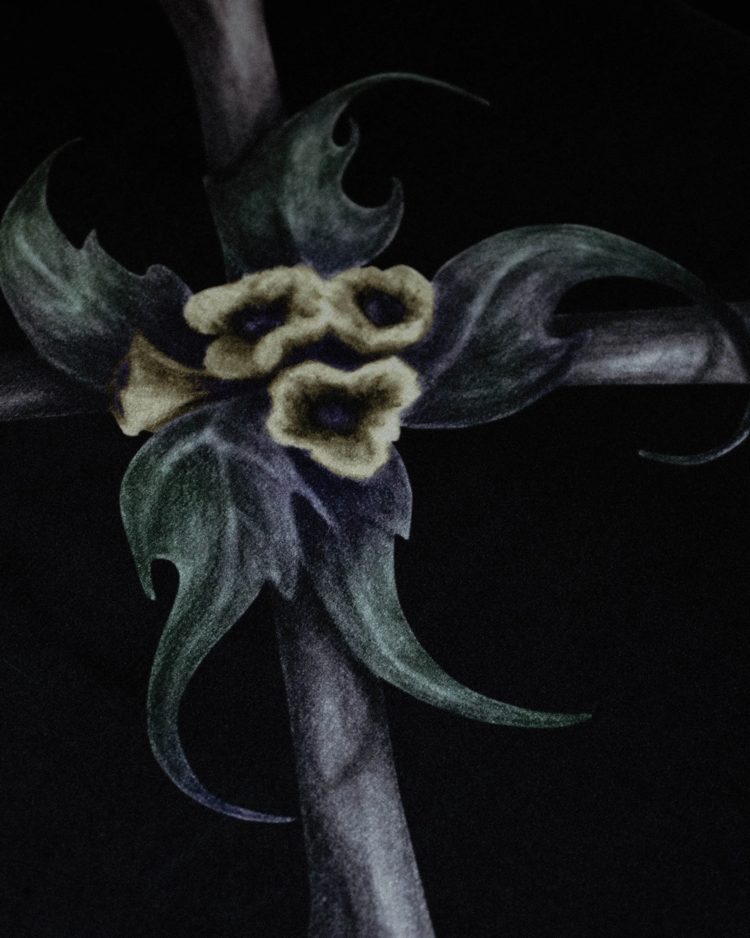 Close-up of a decorative black nail with a metallic silver swirl and a small plush black bow with purple accents on a black background.