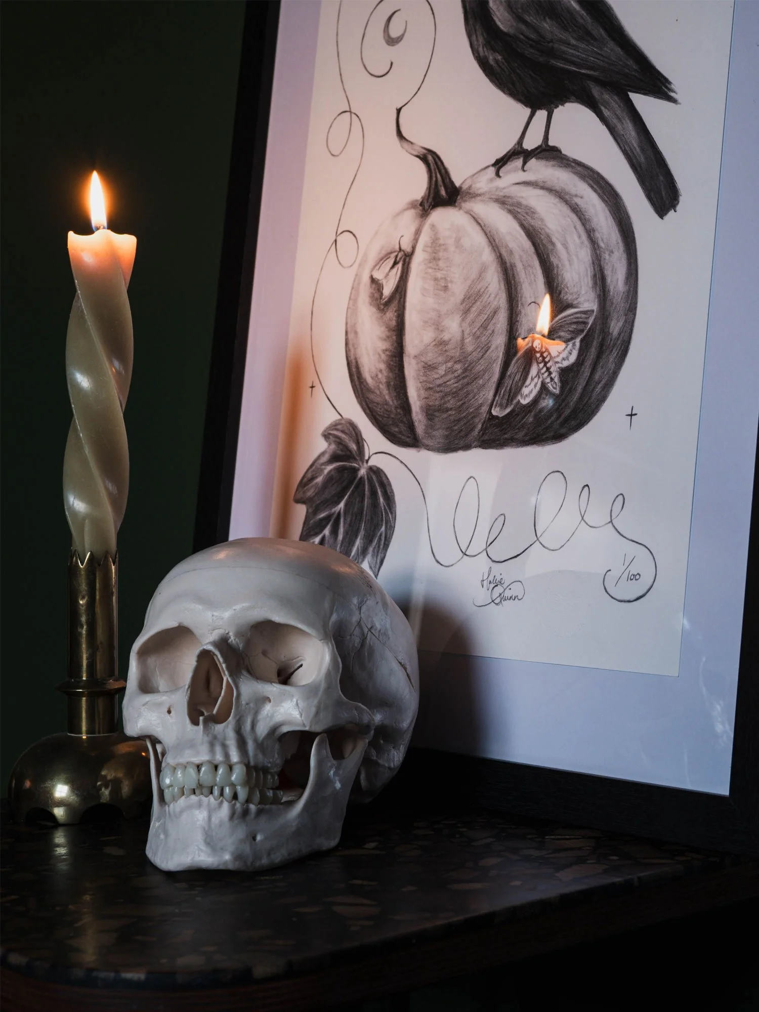 Styled image of the All Hallows Eve framed illustration with a lit candle and skull.