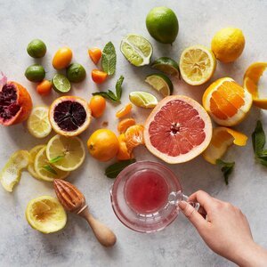 Different+types+of+citrus+halved+on+marble+table.jpeg