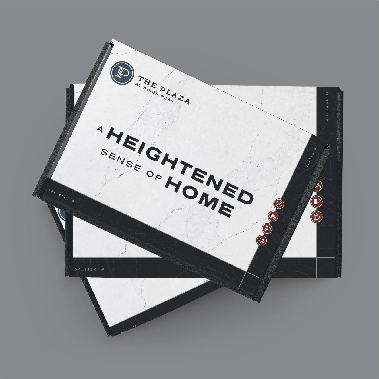 The Plaza at Pikes Peak welcome box design with tagline and iconography