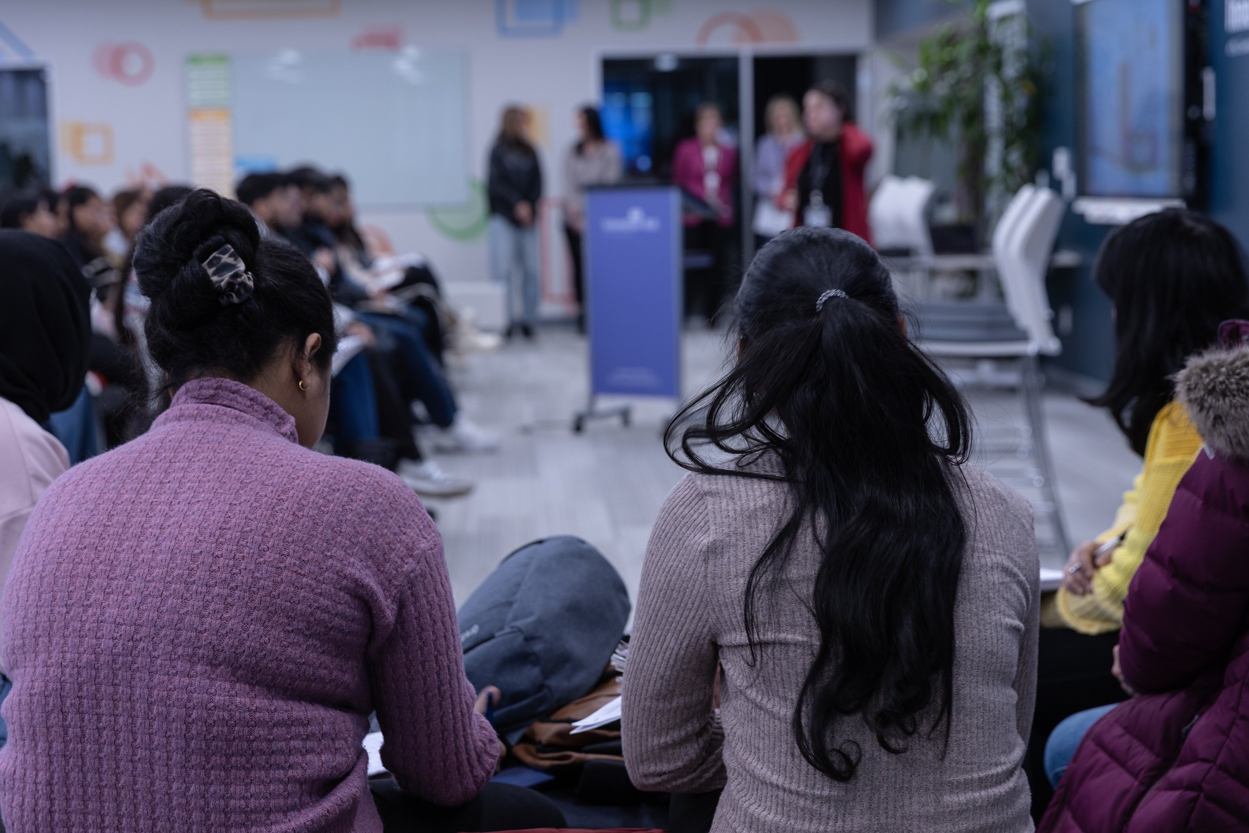Group of students listening.jpg