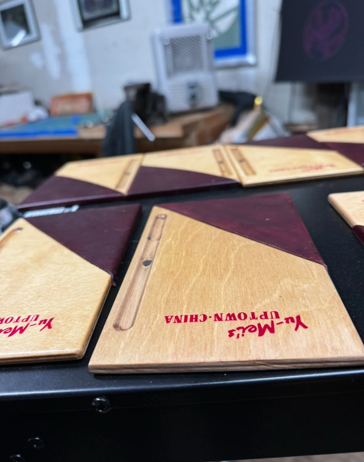 Close-up of a wooden menu board from Yu-Mei's Uptown-China restaurant