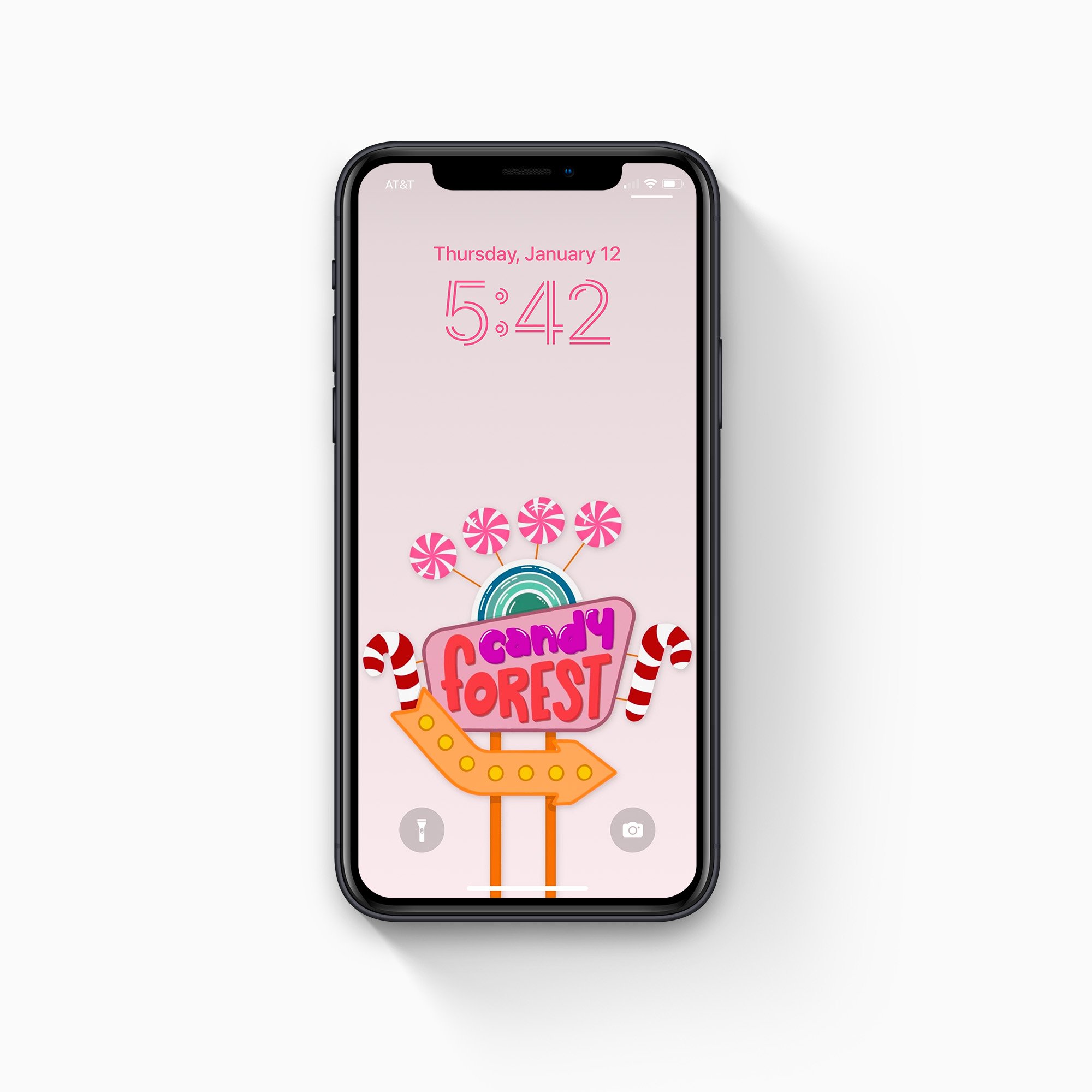 iPhone showcasing candy forest wallpaper