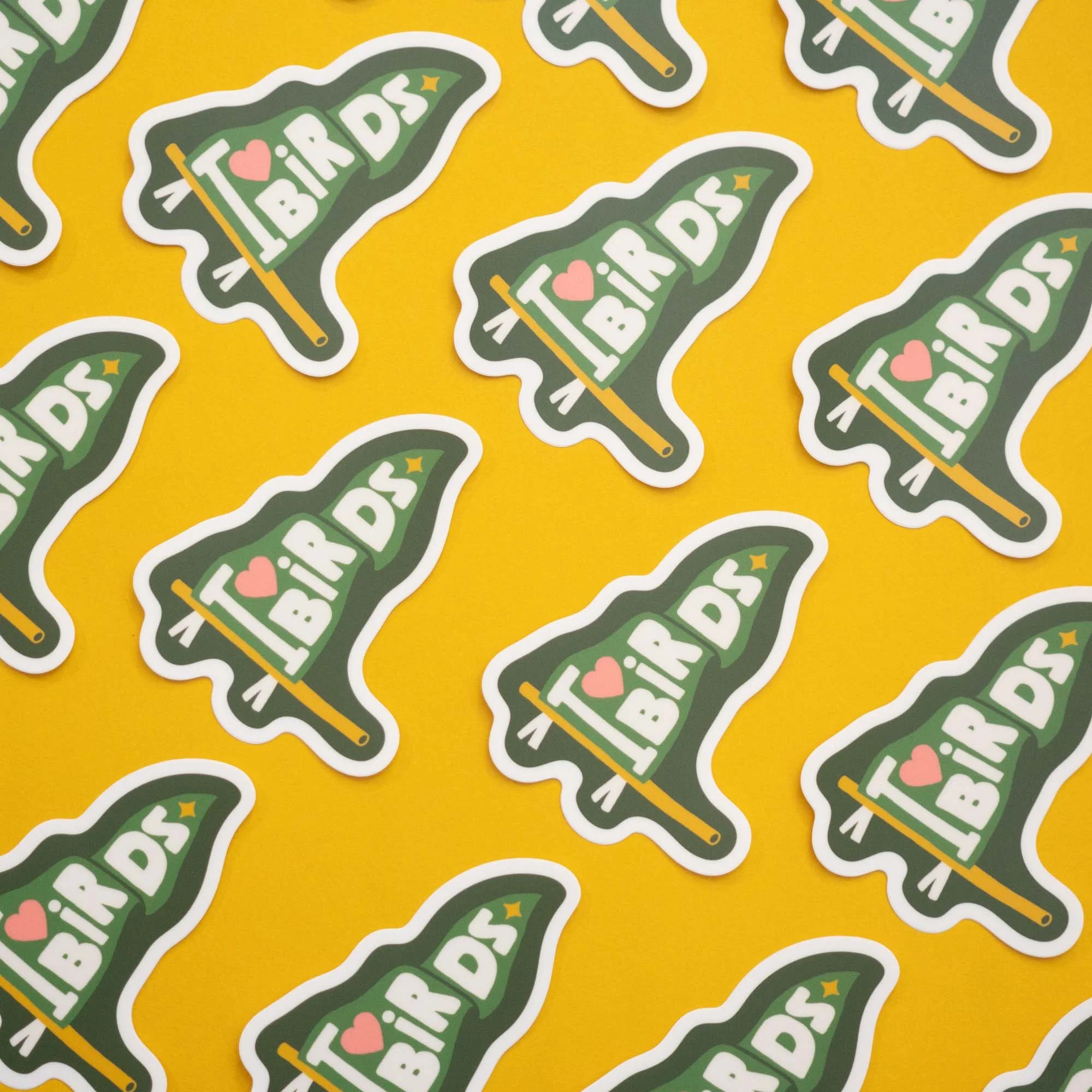 Vinyl stickers of a pennant that reads I Love Birds